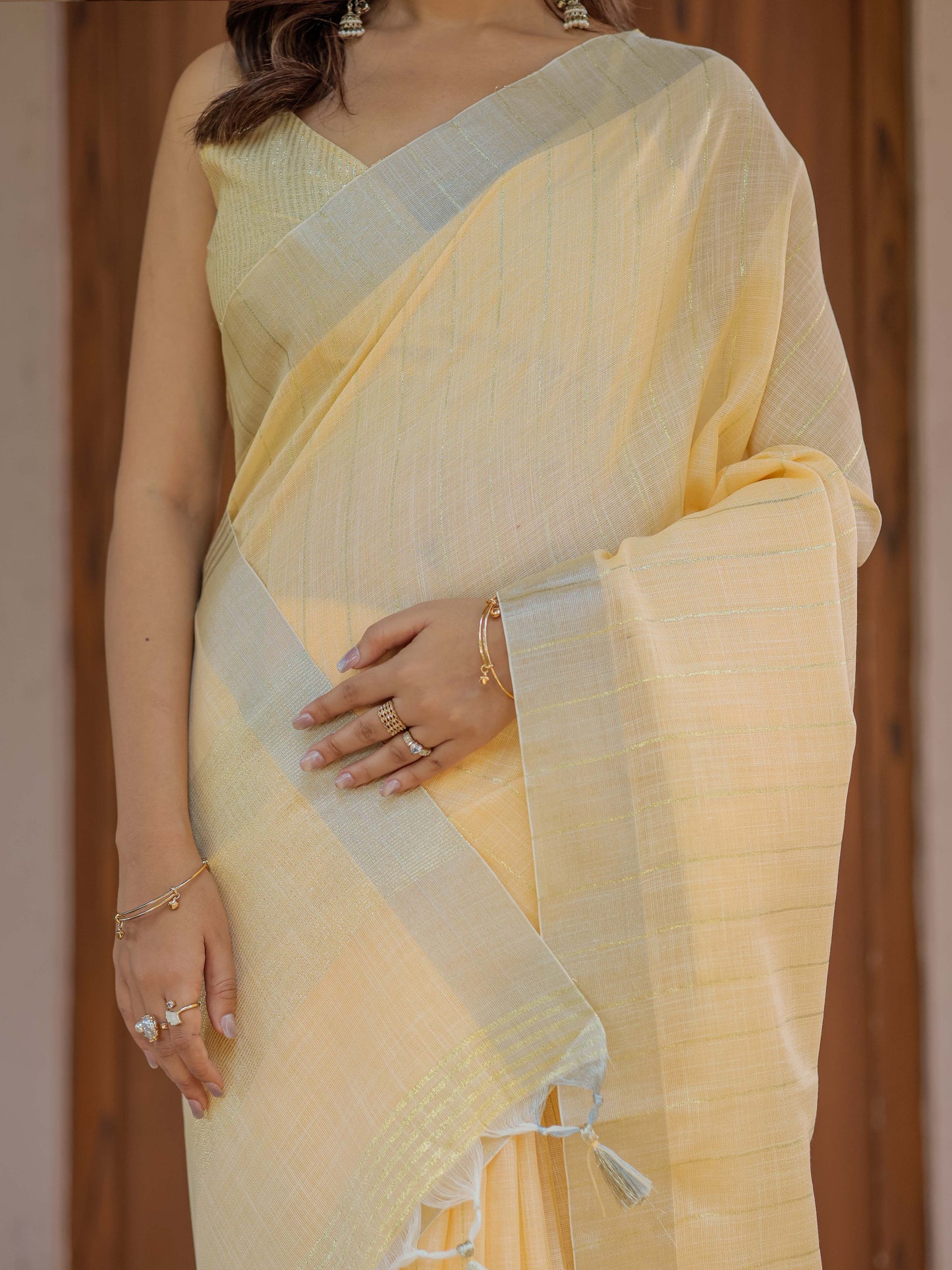 Butter Yellow Pure Handloom Mul Cotton Saree with Golden Striped Weaving & Tassel Detailing