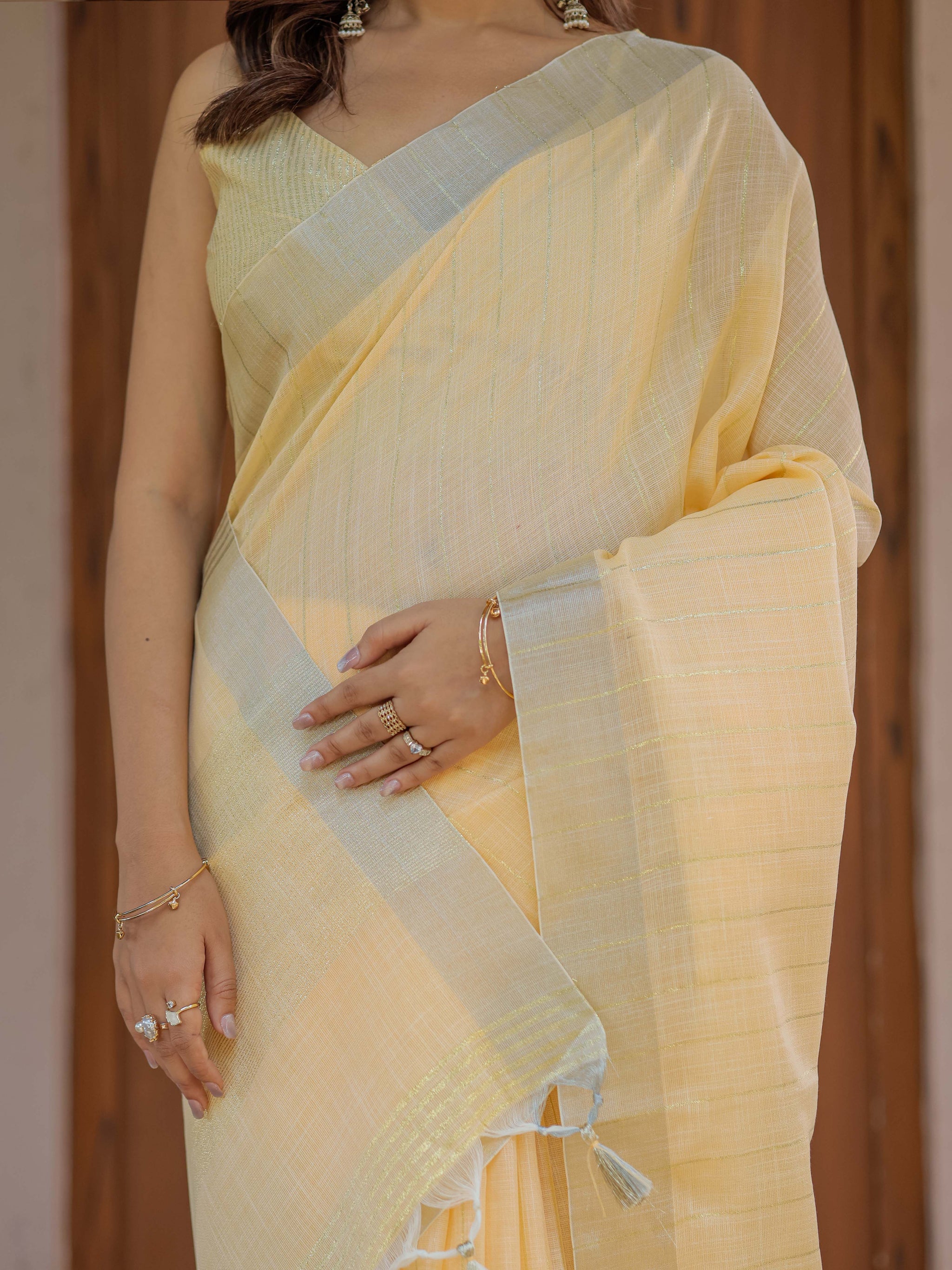 Butter Yellow Pure Handloom Mul Cotton Saree with Golden Striped Weaving & Tassel Detailing