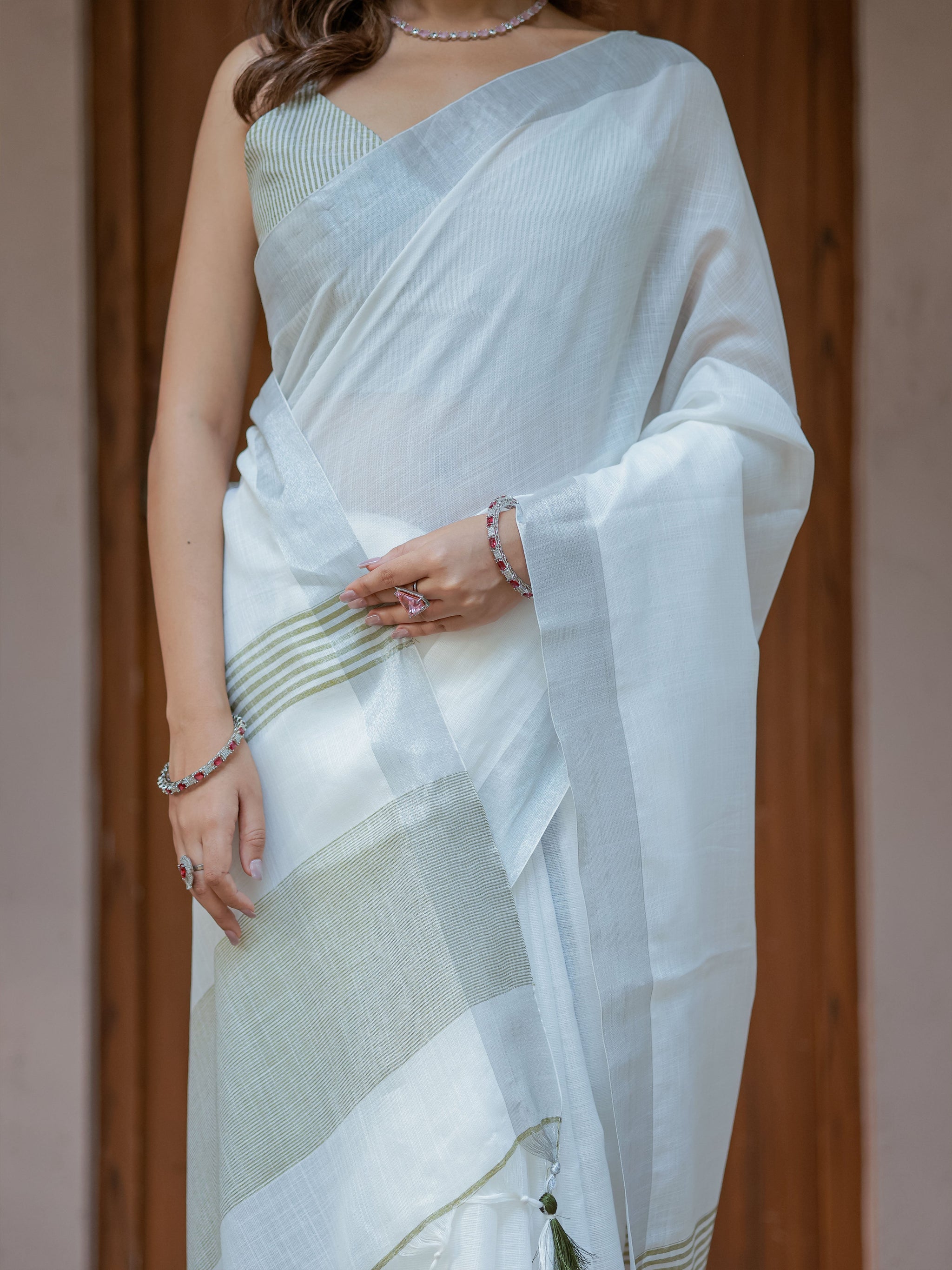 Pure White & Olive Green Handloom Mul Cotton Saree with Minimal Striped Border & Tassel Detailing
