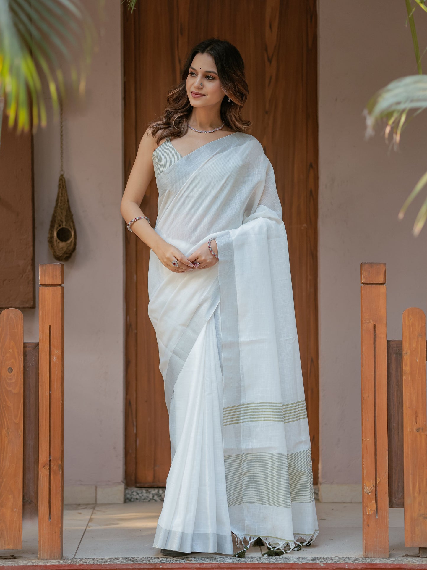Pure White & Olive Green Handloom Mul Cotton Saree with Minimal Striped Border & Tassel Detailing