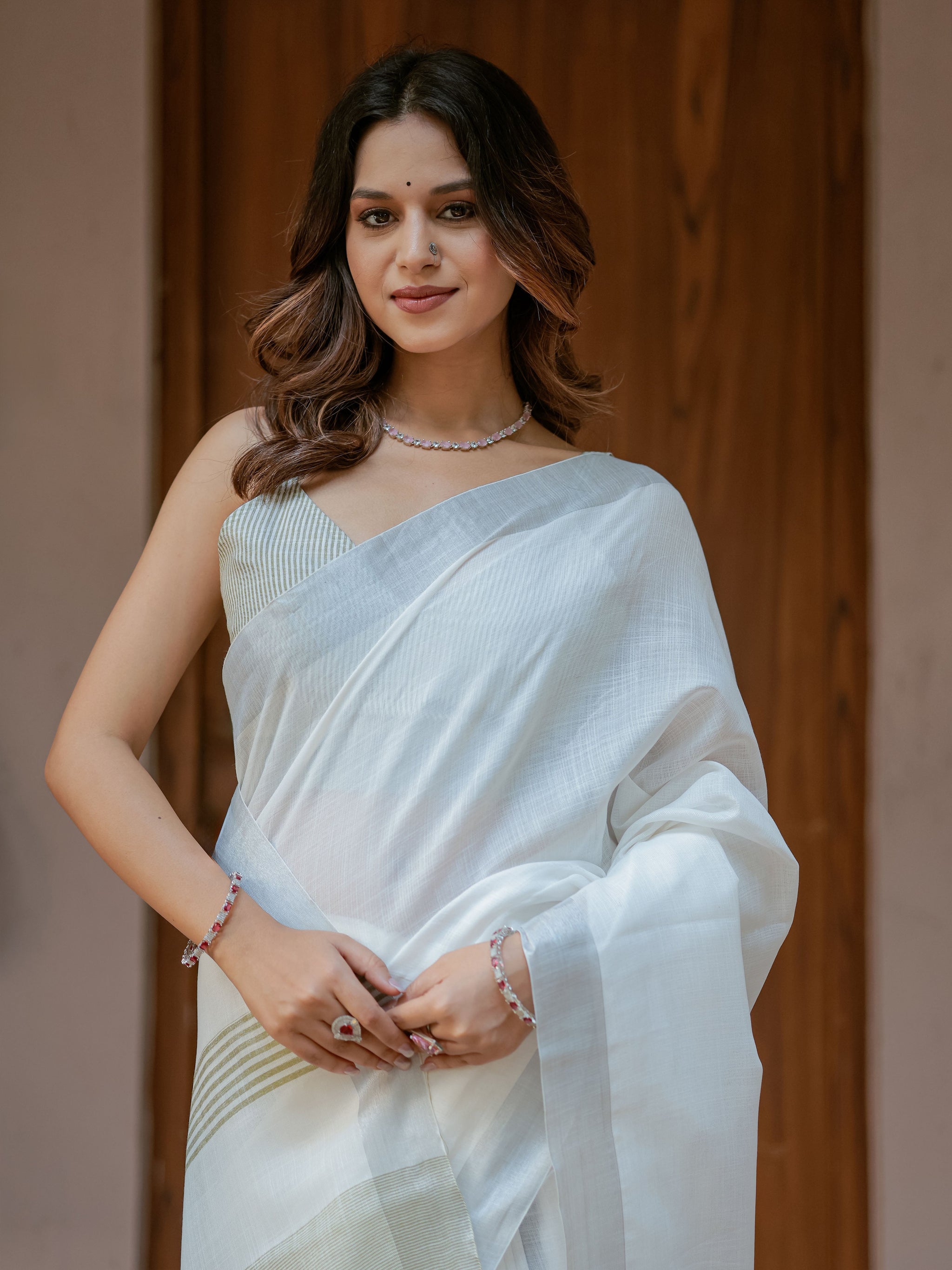 Pure White & Olive Green Handloom Mul Cotton Saree with Minimal Striped Border & Tassel Detailing