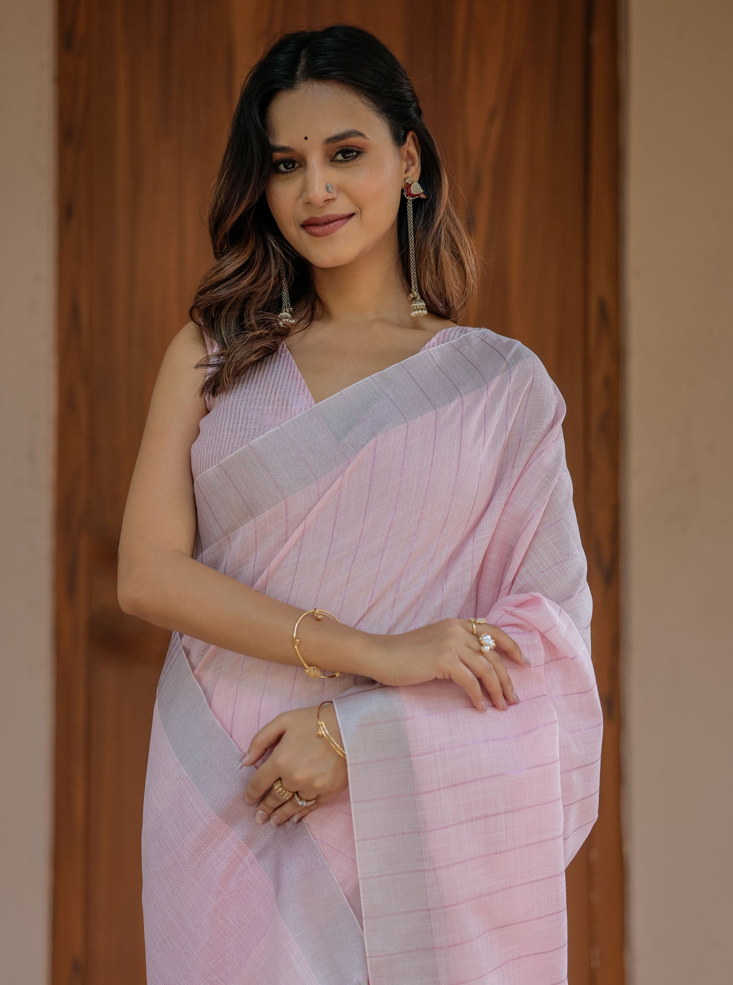Soft Peach Pink Handloom Mul Cotton Saree with Subtle Striped Weaving & Tassel Detailing
