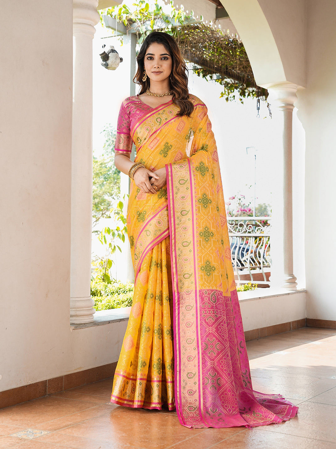 Yellow organza zari woven patola saree