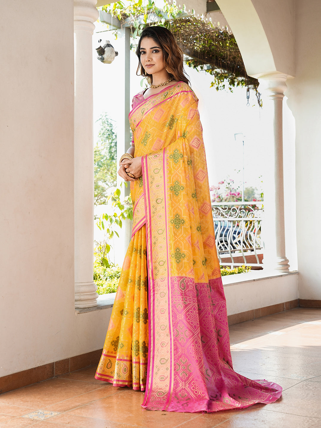 Yellow organza zari woven patola saree