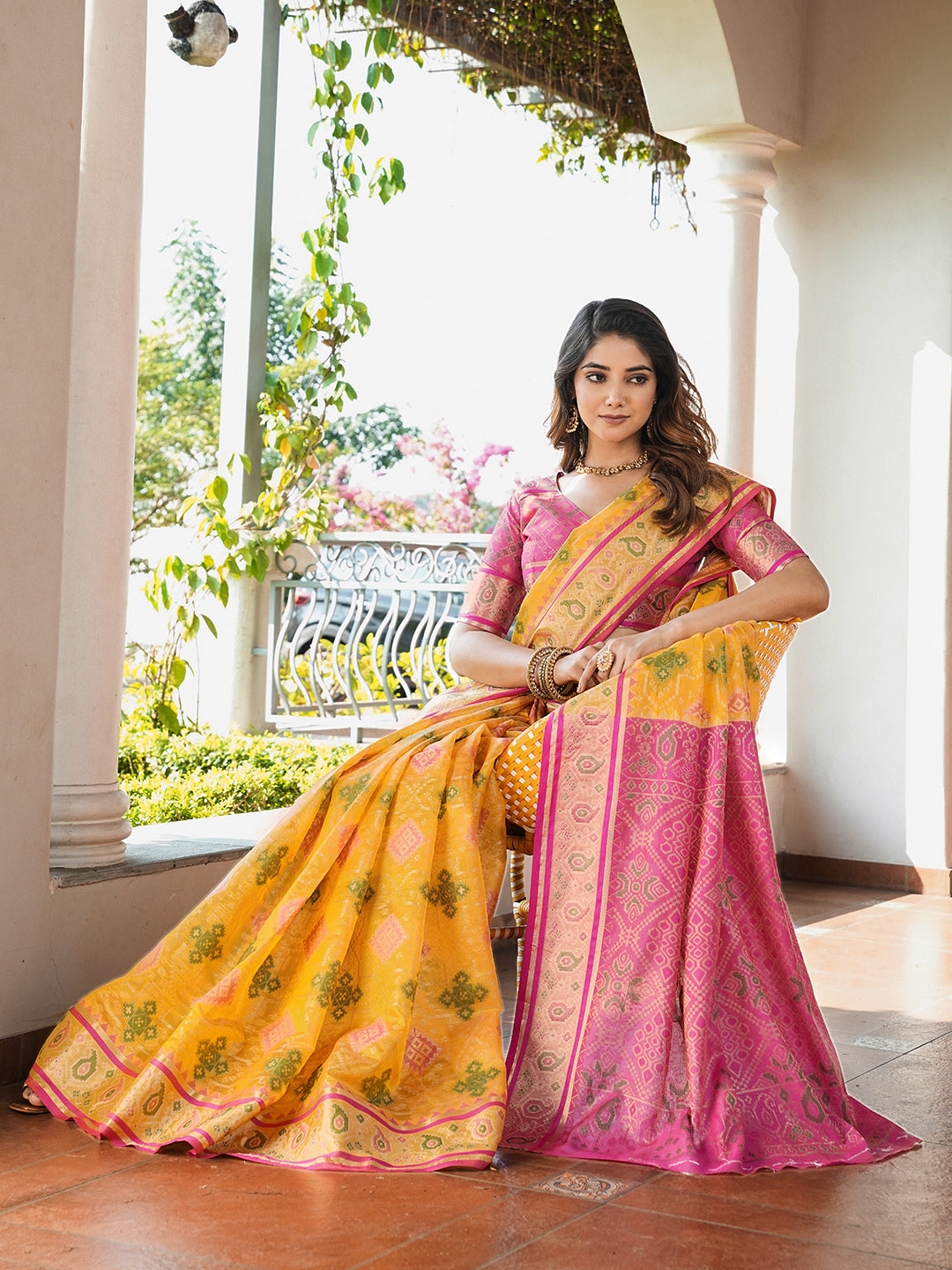 Yellow organza zari woven patola saree