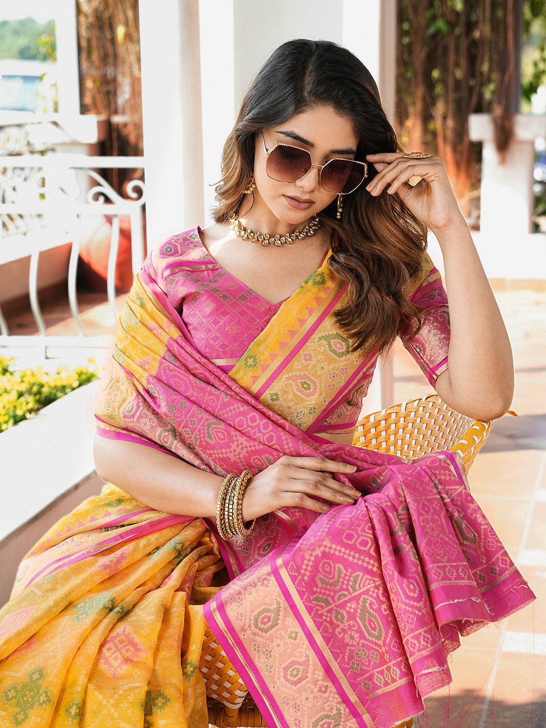 Yellow organza zari woven patola saree