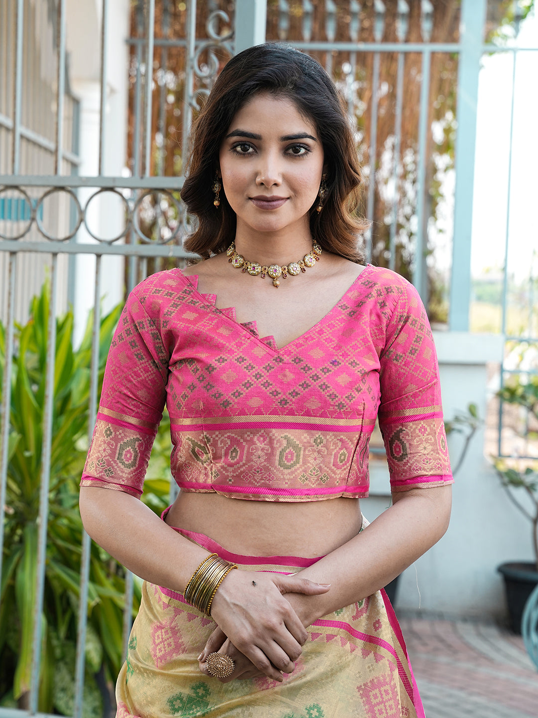Cream organza zari woven patola saree