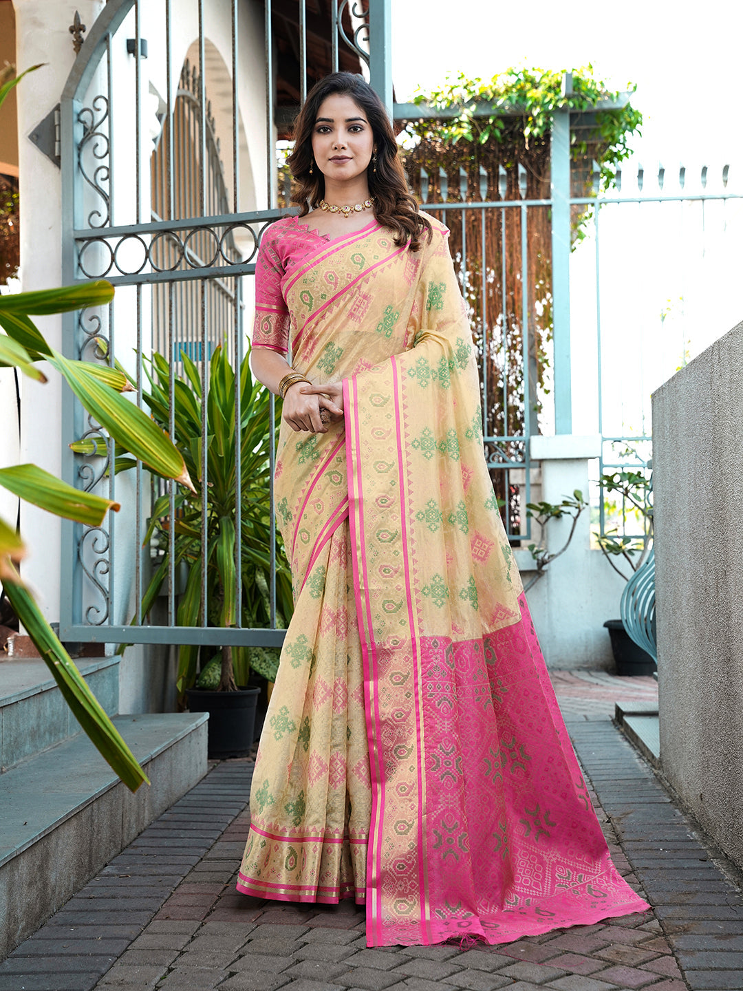 Cream organza zari woven patola saree