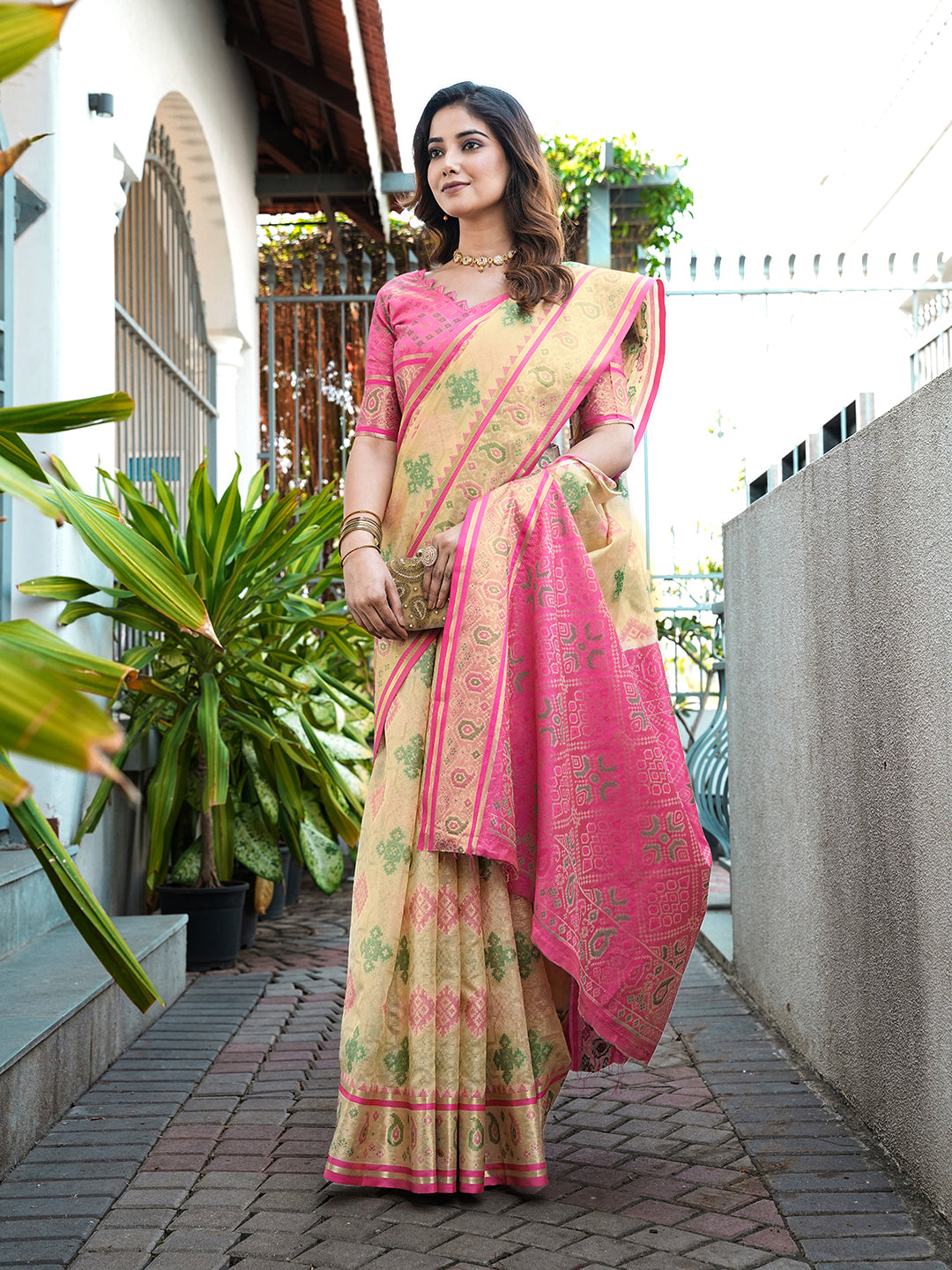 Cream organza zari woven patola saree