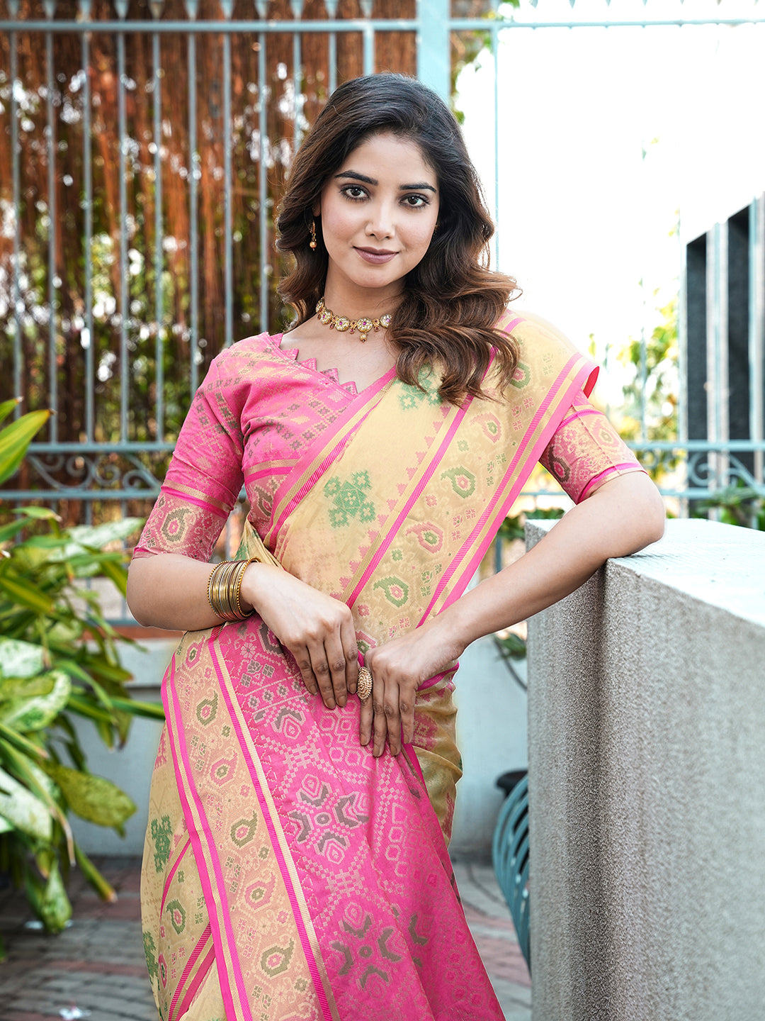 Cream organza zari woven patola saree