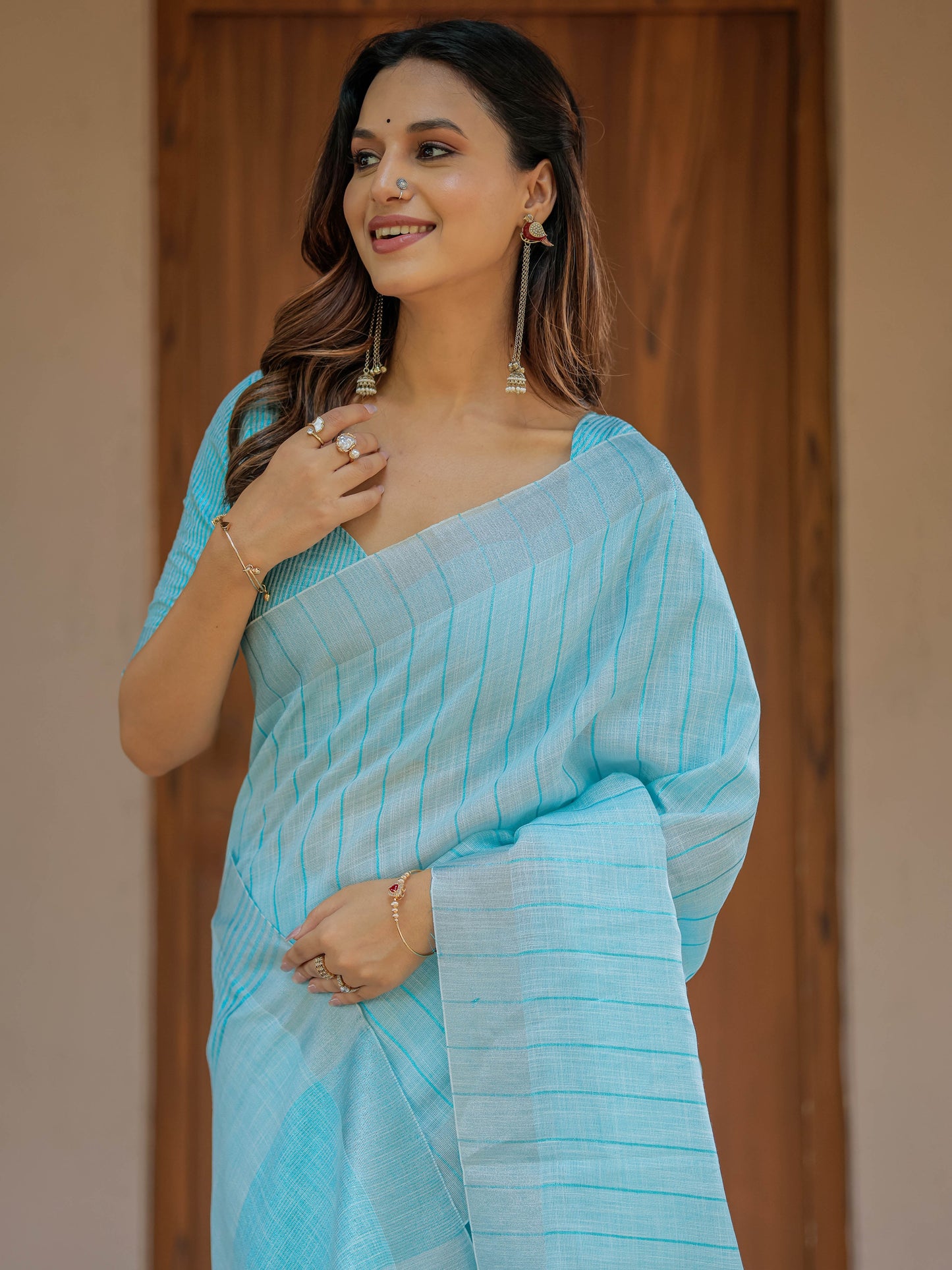 Aqua Blue Pure Handloom Mul Cotton Saree with Striped Weaving & Tassel Detailing