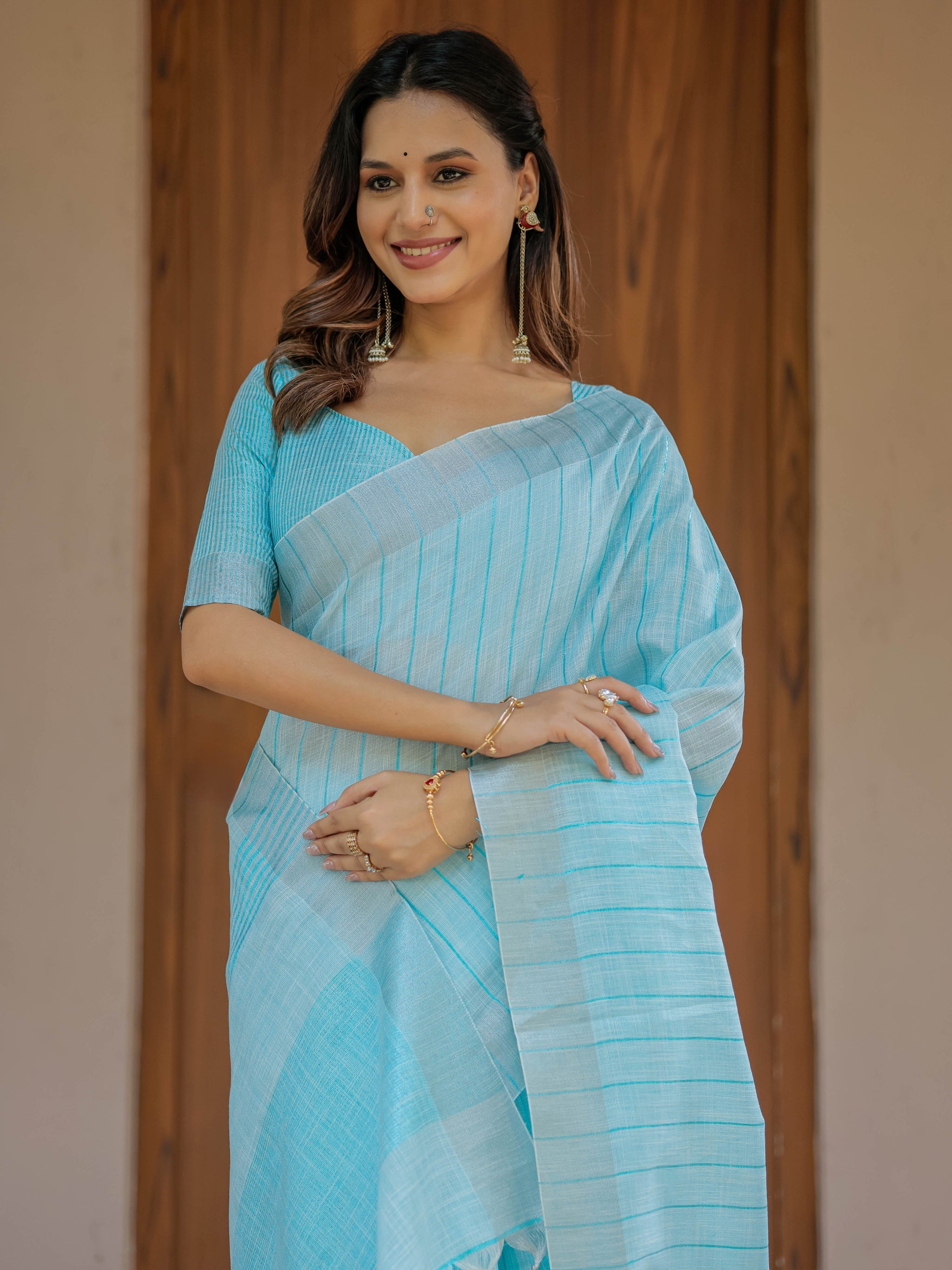 Aqua Blue Pure Handloom Mul Cotton Saree with Striped Weaving & Tassel Detailing