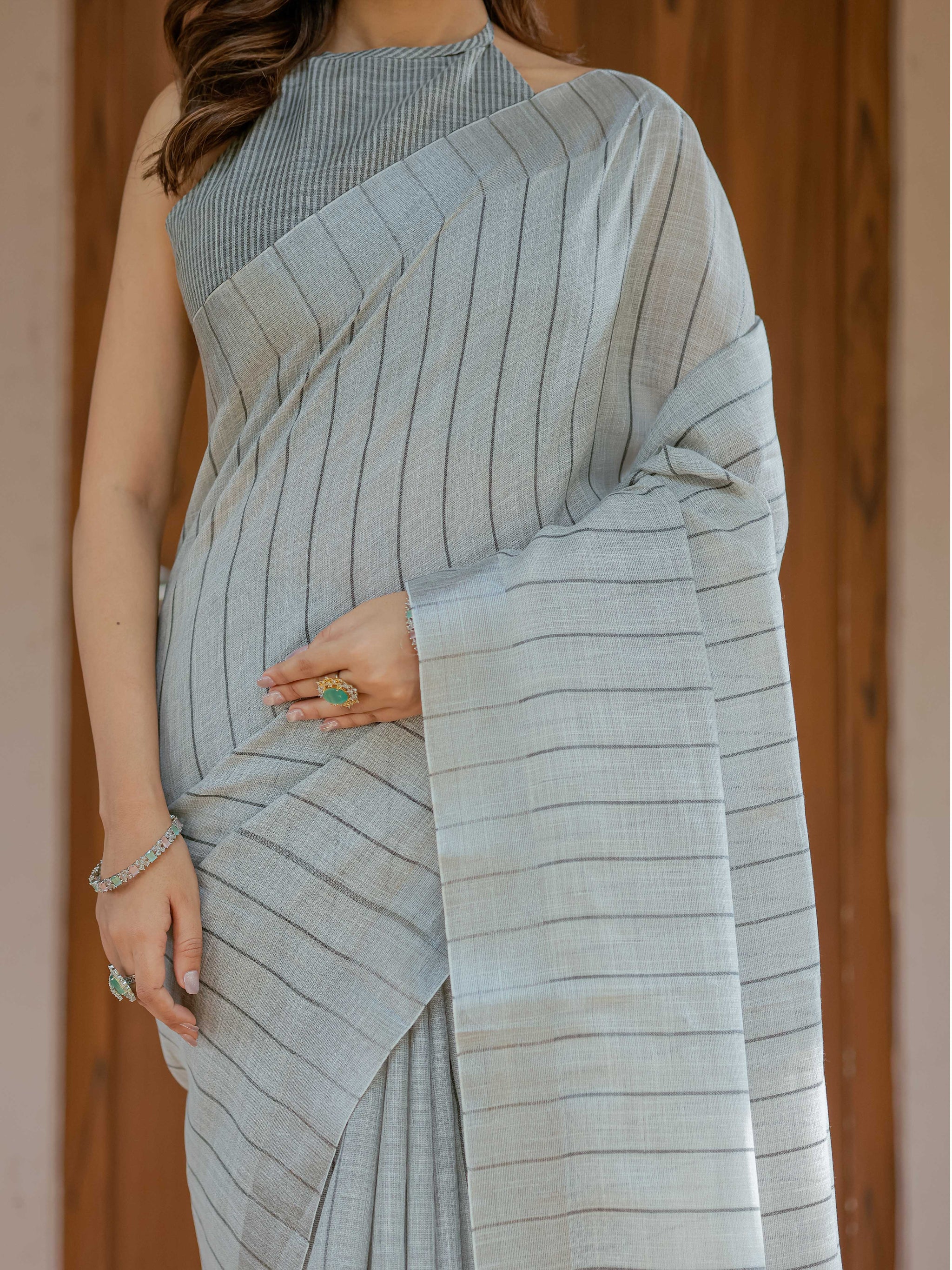 Elegant Ash Grey Handloom Mul Cotton Saree with Minimal Striped Weaving & Tassel Detailing