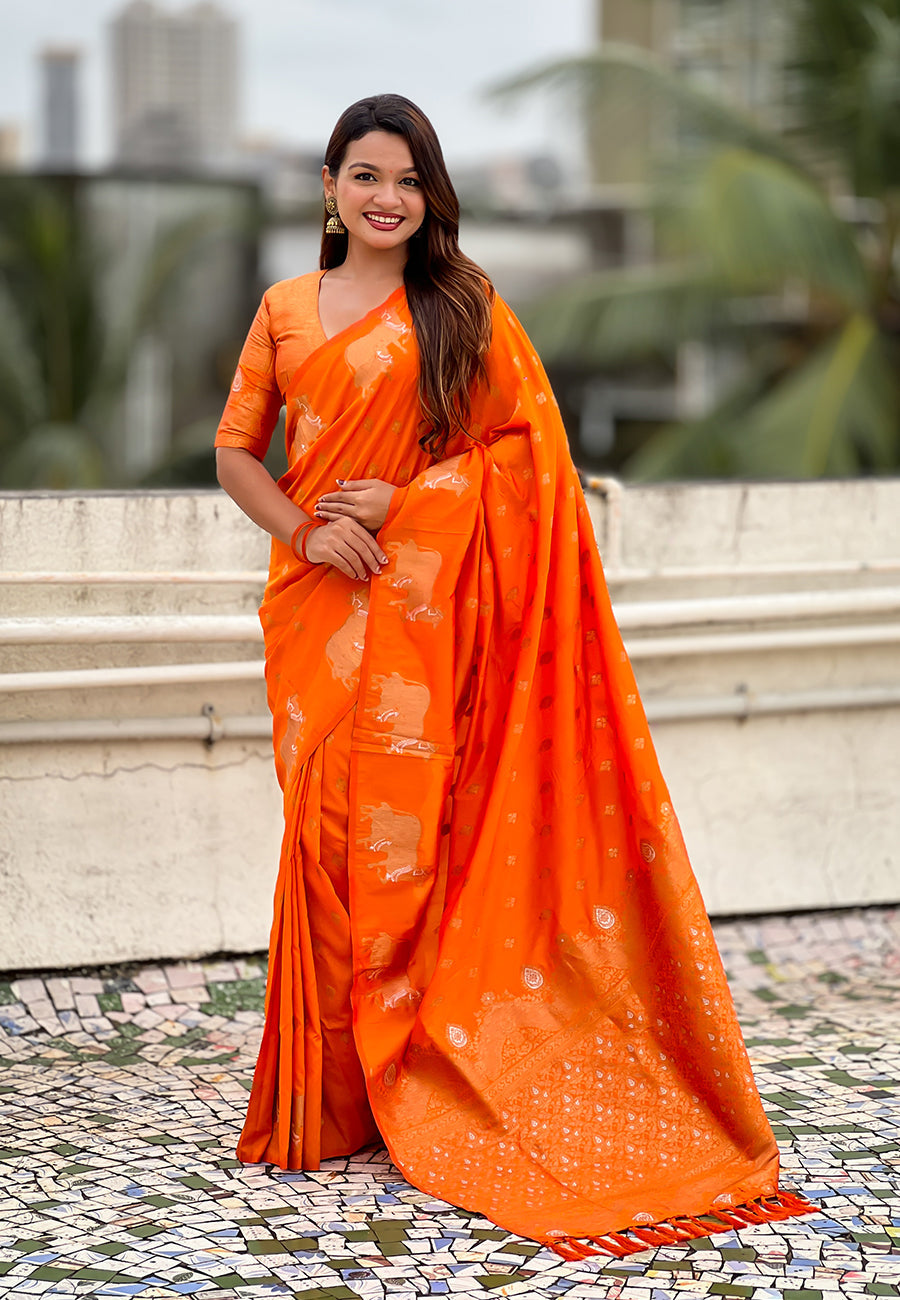 Orange soft silk dual zari woven saree with nandi border