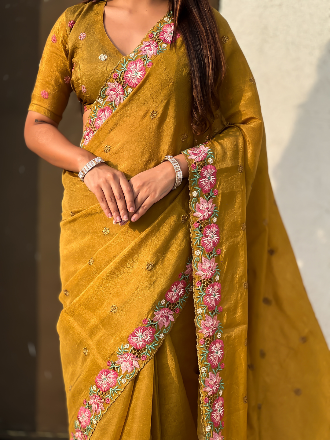 Mustard pure crush embroidered saree with multicolor floral motifs and cutwork border