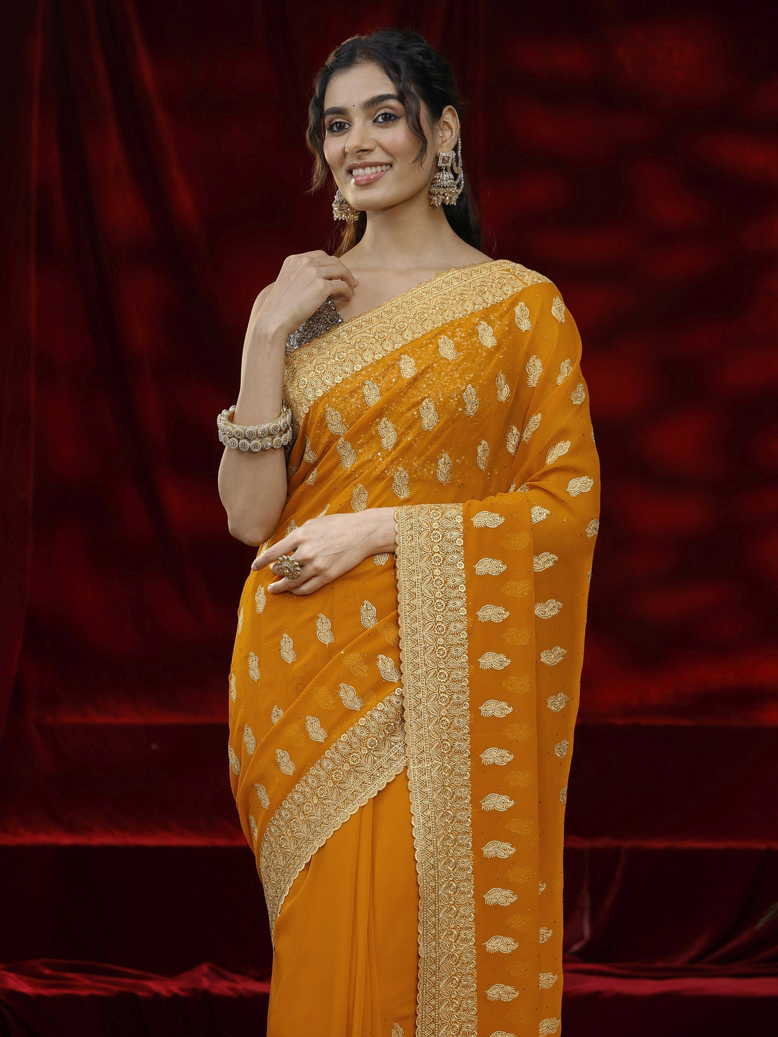 Mameraa Orange Embroidered Georgette Saree