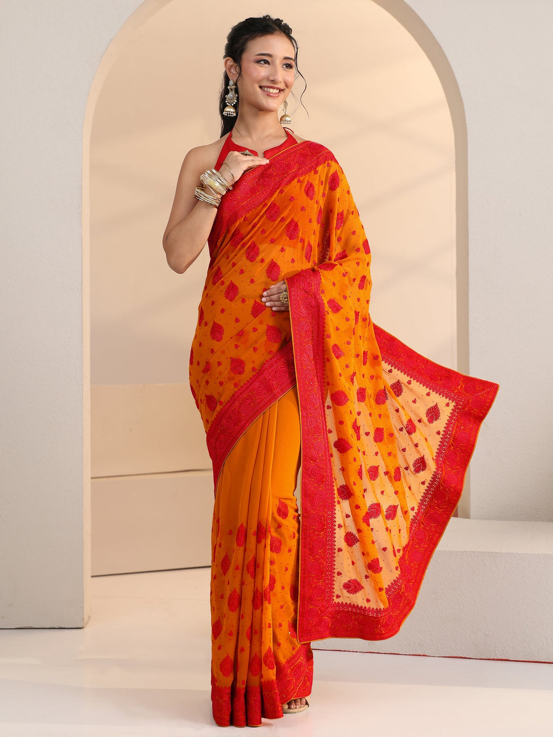 Mameraa Pulp Orange Georgette Saree with Embroidered Border