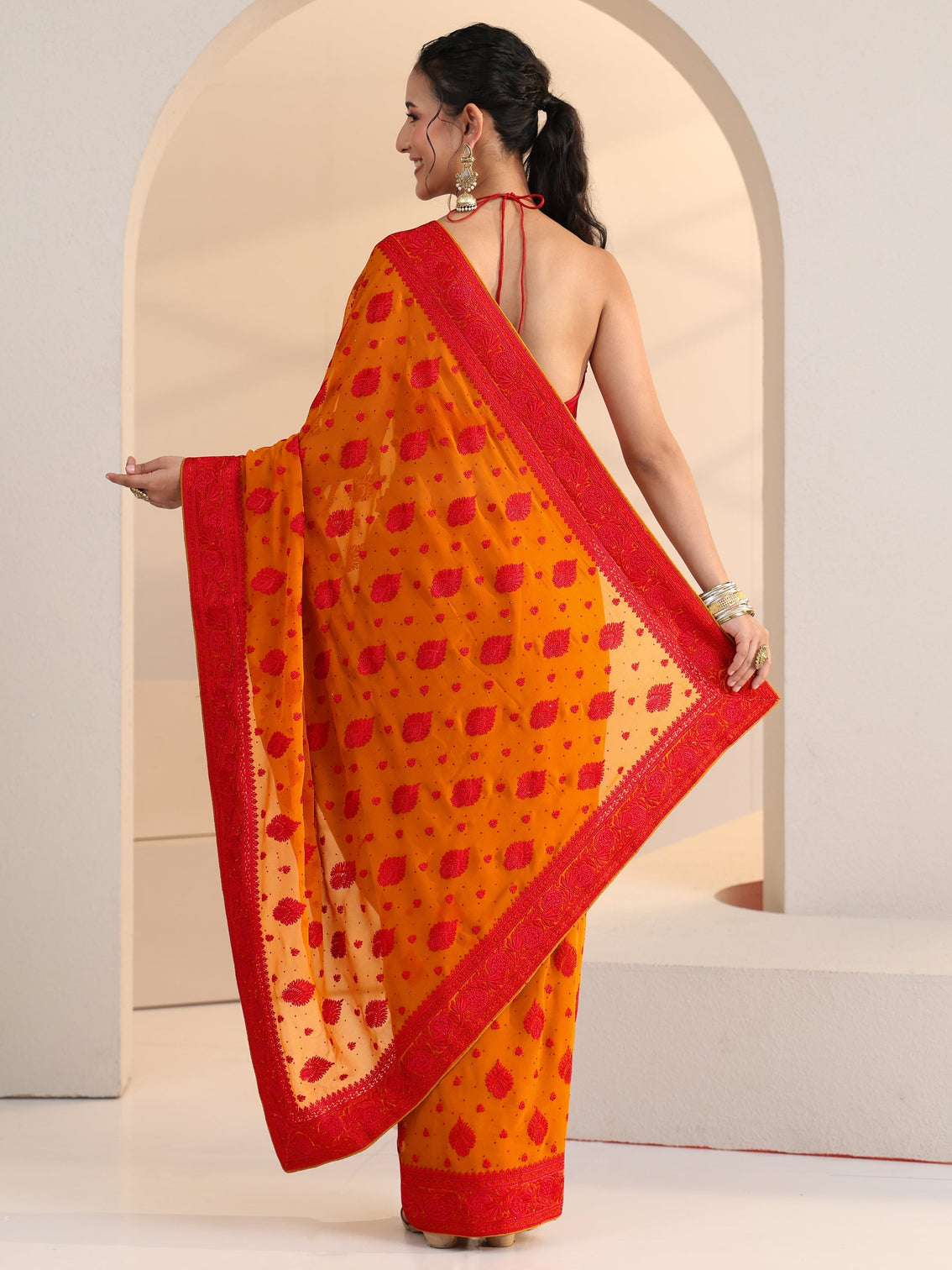 Mameraa Pulp Orange Georgette Saree with Embroidered Border