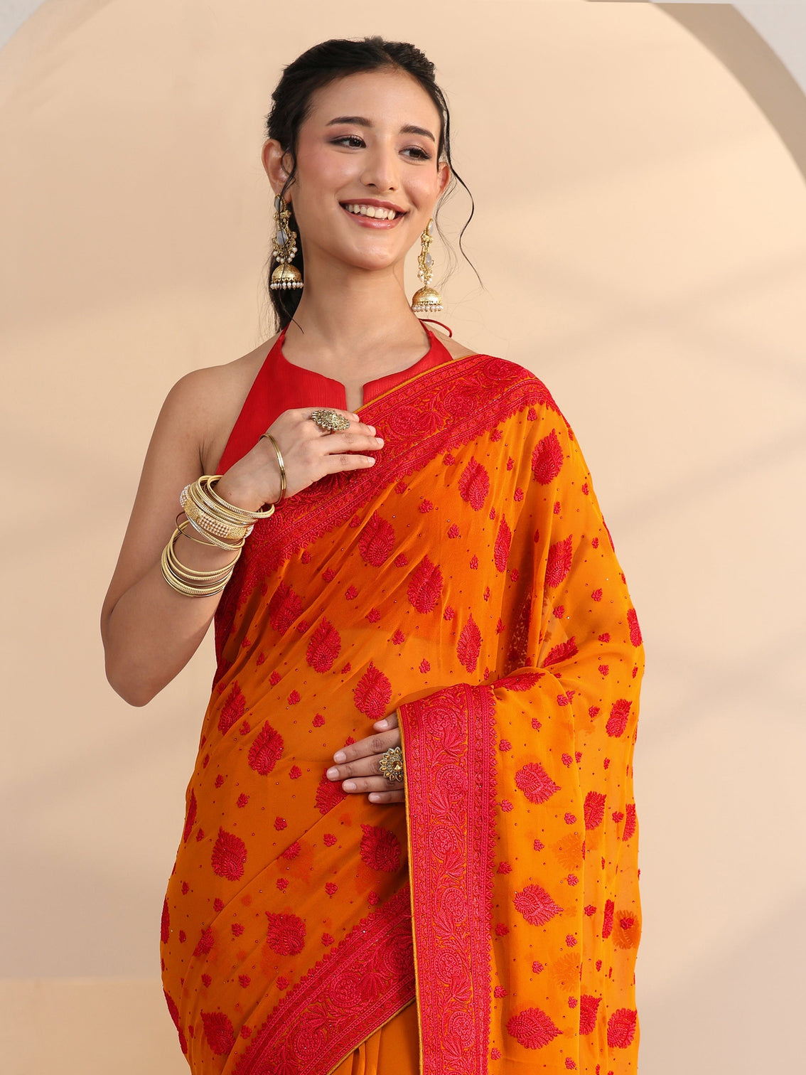 Mameraa Pulp Orange Georgette Saree with Embroidered Border