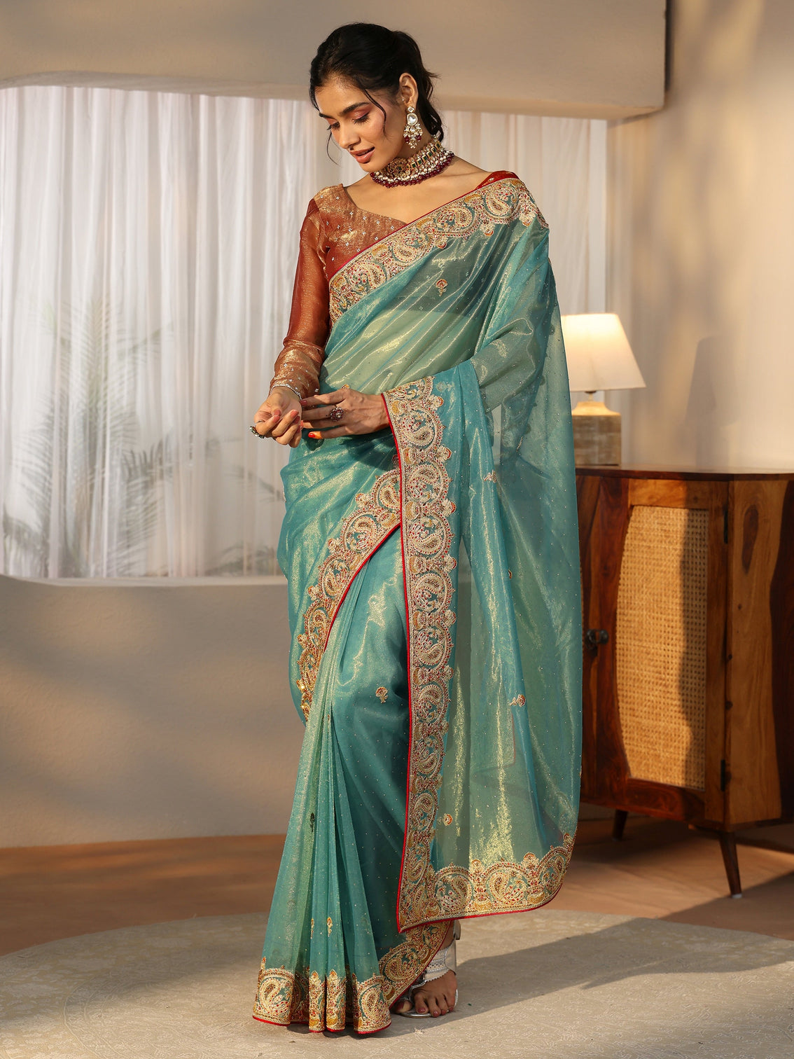 Mameraa Aqua Blue Net Saree with Embellished Paisley Border