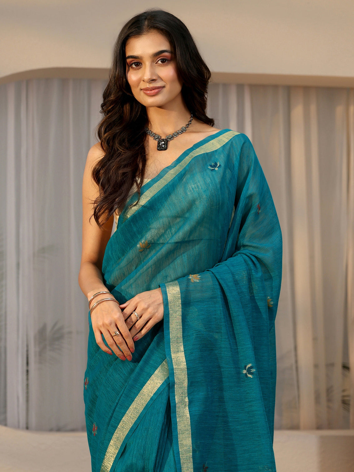 Mameraa Teal Blue Woven Design Floral Pallu Silk Blend Saree