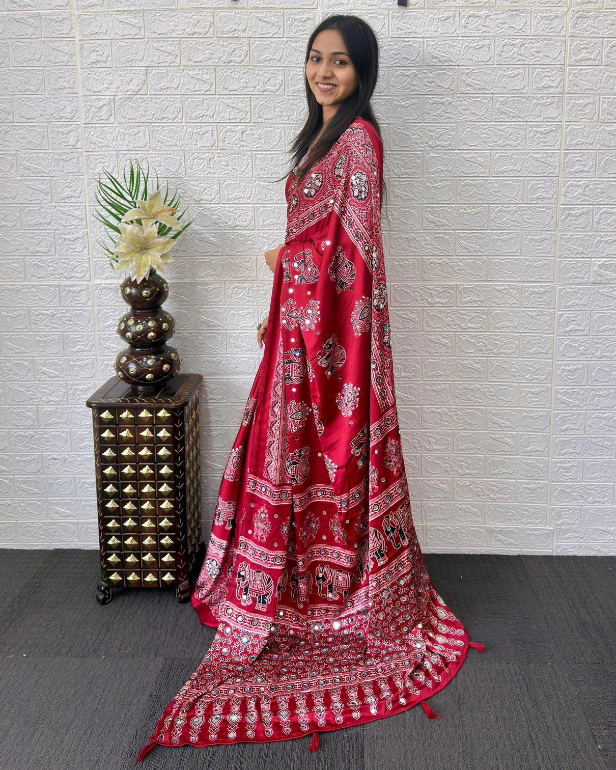 Maroon modal silk ajrakh print saree with traditional elephant motifs designer pallu tassels festive ethnic wear saree