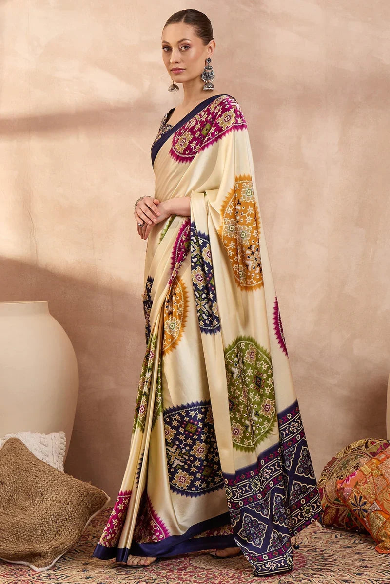 Cream modal silk saree with multicolor patola inspired print royal purple border designer festive wear saree