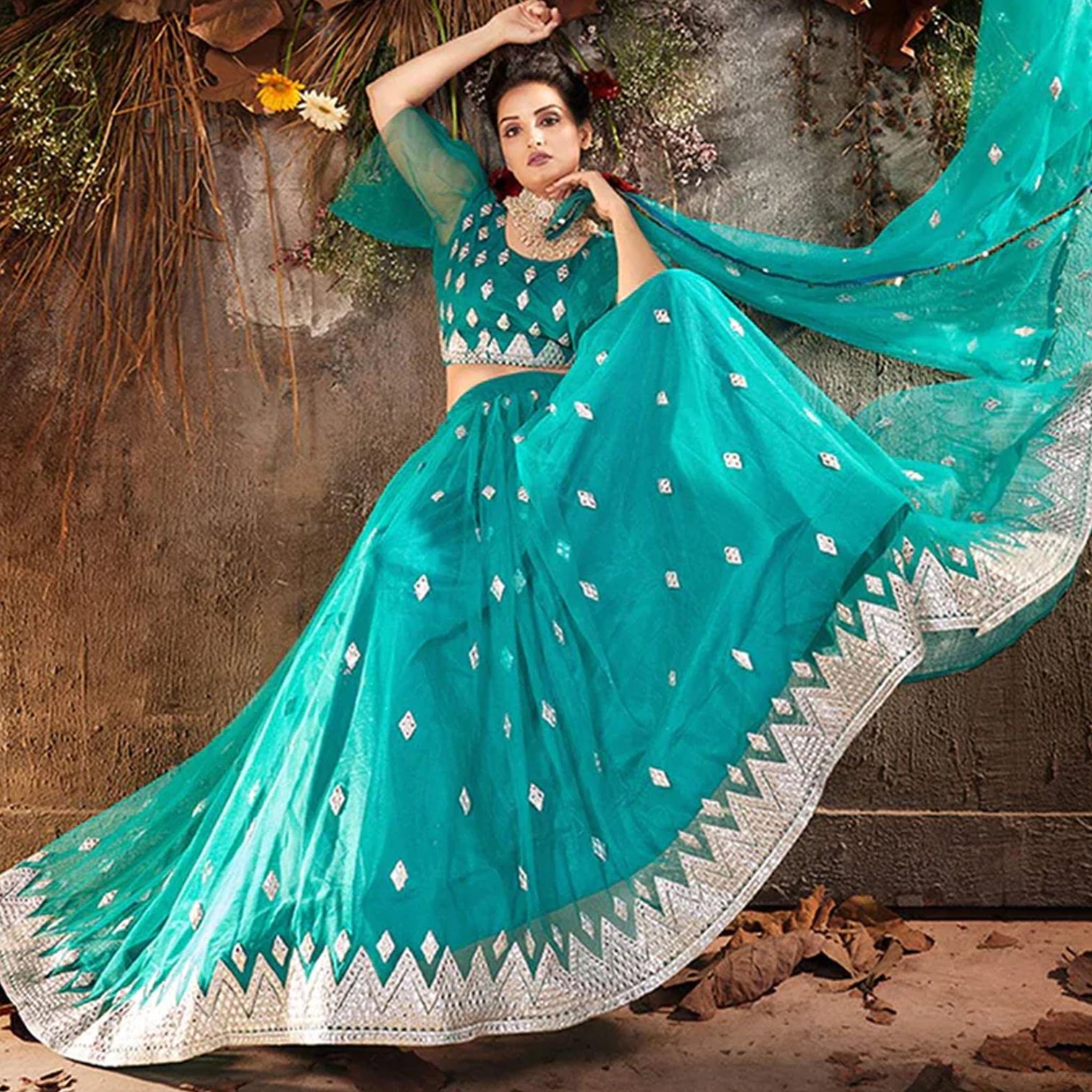 Sea Green Lehenga Choli in Soft Net with Embroidery