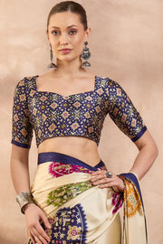 Cream modal silk saree with multicolor patola inspired print royal purple border designer festive wear saree