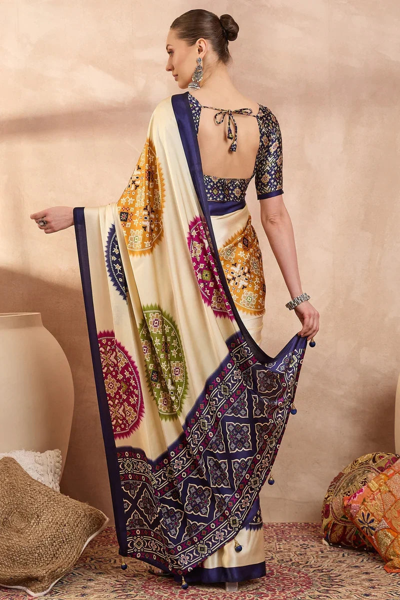 Cream modal silk saree with multicolor patola inspired print royal purple border designer festive wear saree