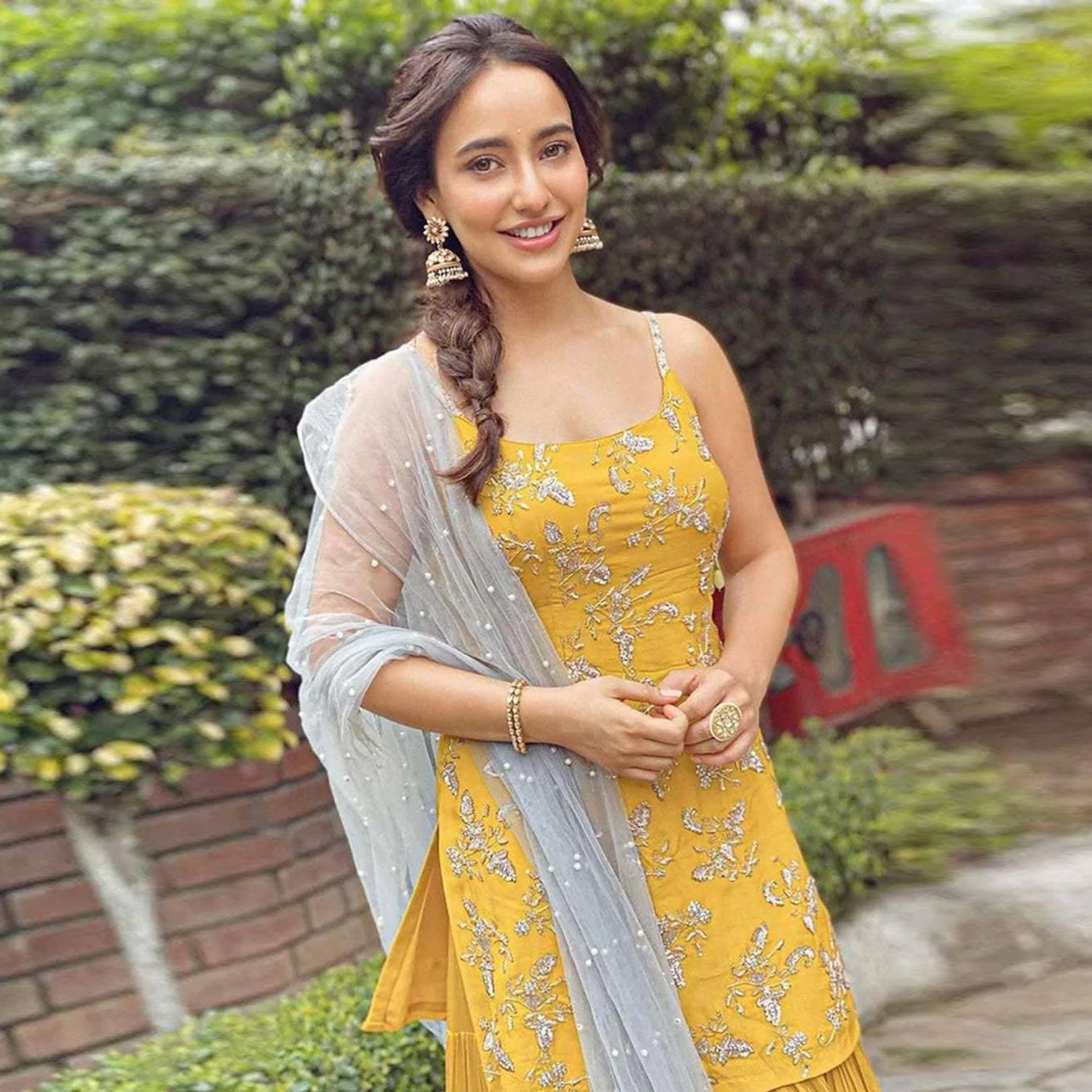 Yellow crape suit with Zari, sequins and pearl work