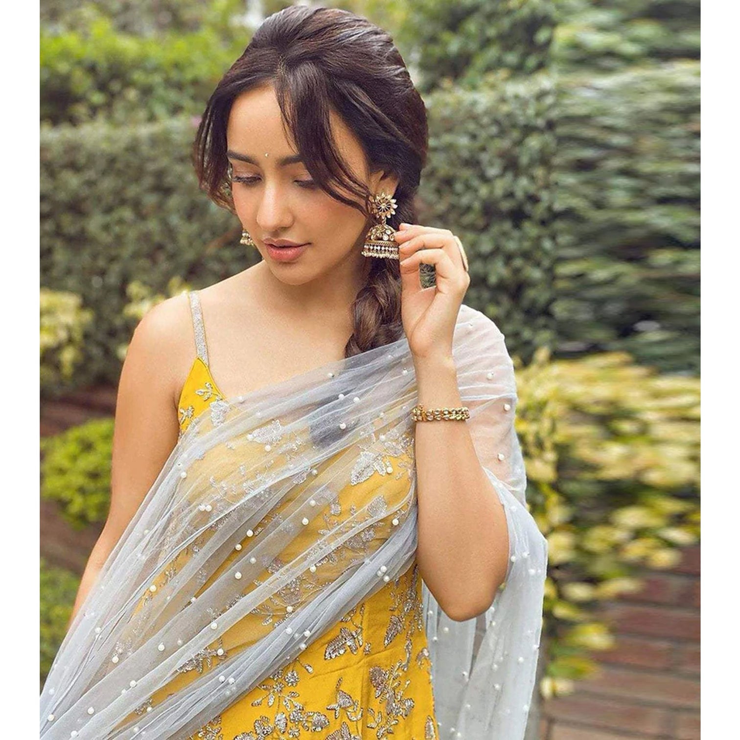 Yellow crape suit with Zari, sequins and pearl work