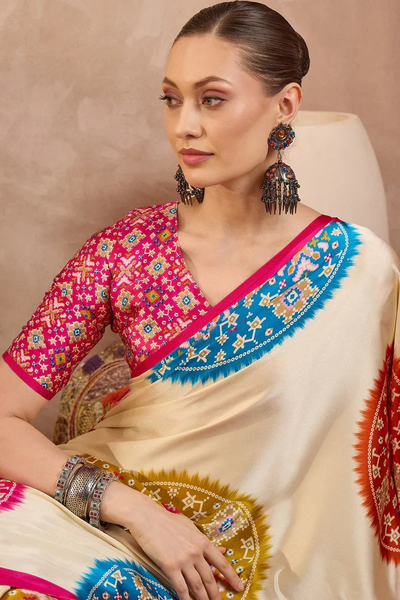 Cream modal silk saree with multicolor patola inspired print rani pink border designer festive wear saree