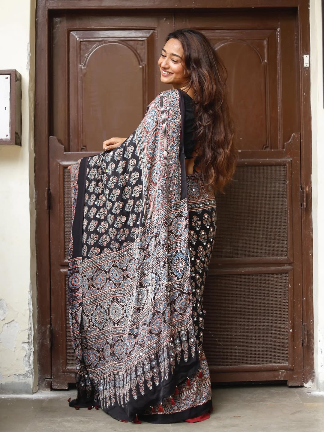 Black ajrakh printed modal silk saree with tassels attached blouse traditional ethnic festive wear saree