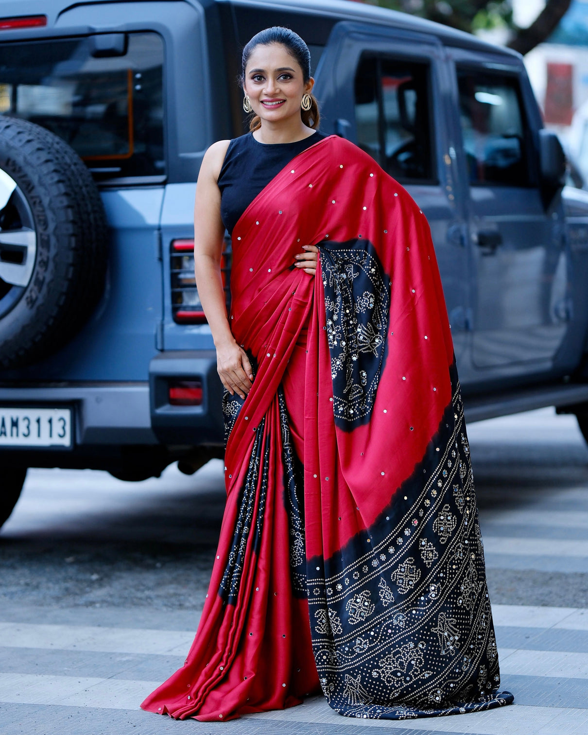 Women s ruby red pure modal silk saree with black folk art border traditional tribal print designer pallu