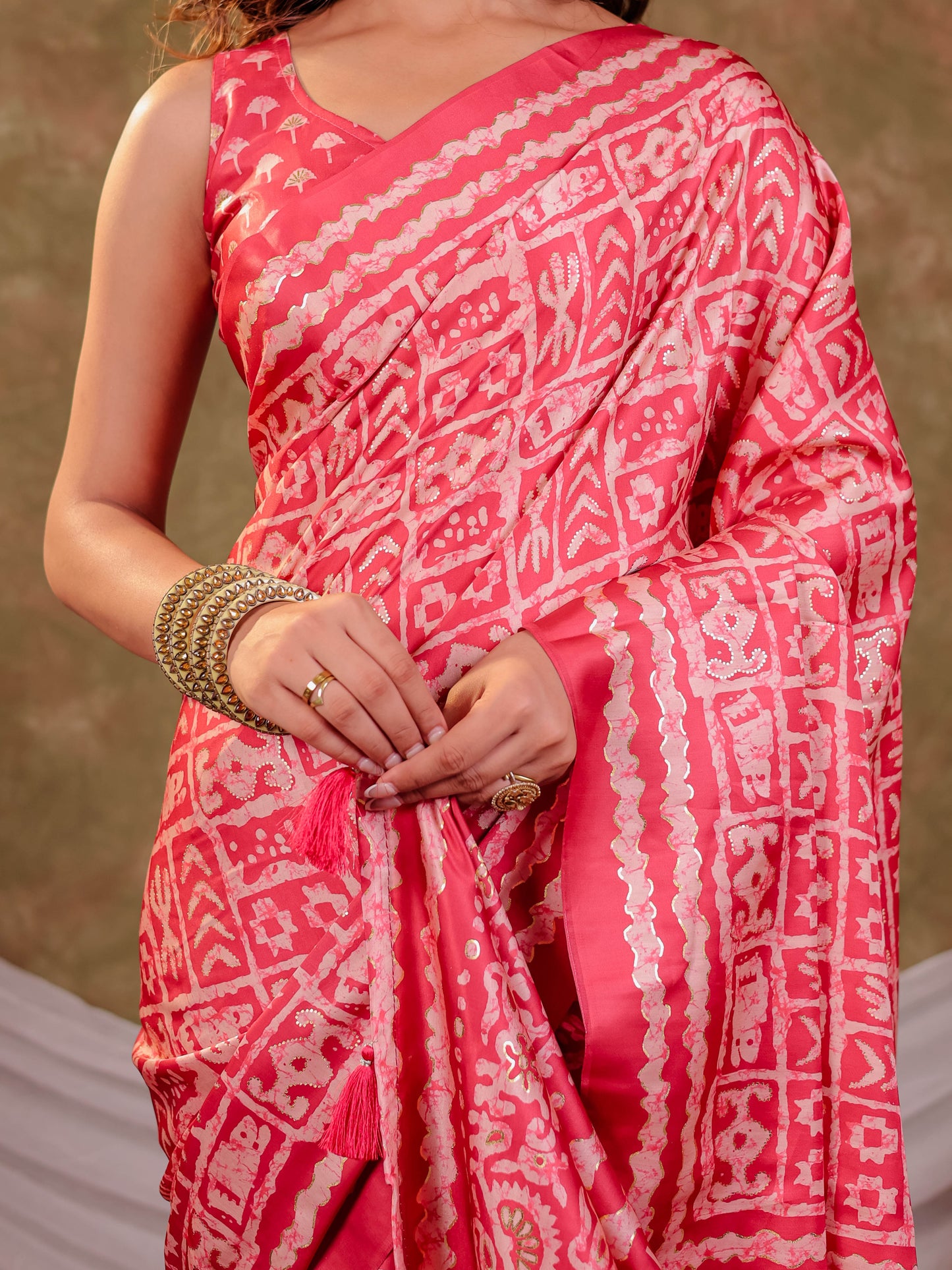 Coral Pink Pure Chinnon Batik Printed Saree with Foil Detailing, Designer Border, Tassel Edges & Matching Blouse Piece