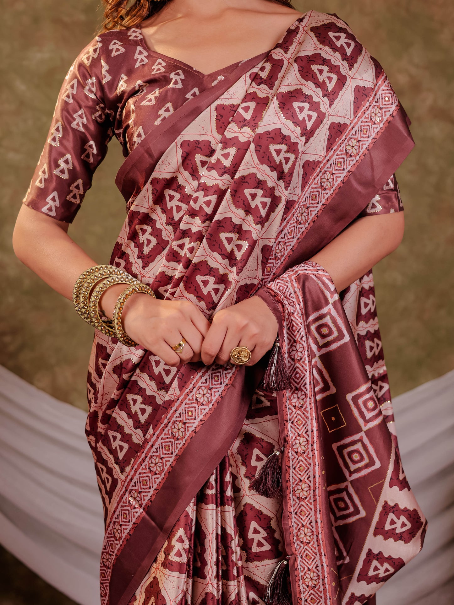 Coffee Brown Pure Chinnon Batik Printed Saree with Foil Detailing, Designer Border, Tassel Edges & Matching Blouse Piece