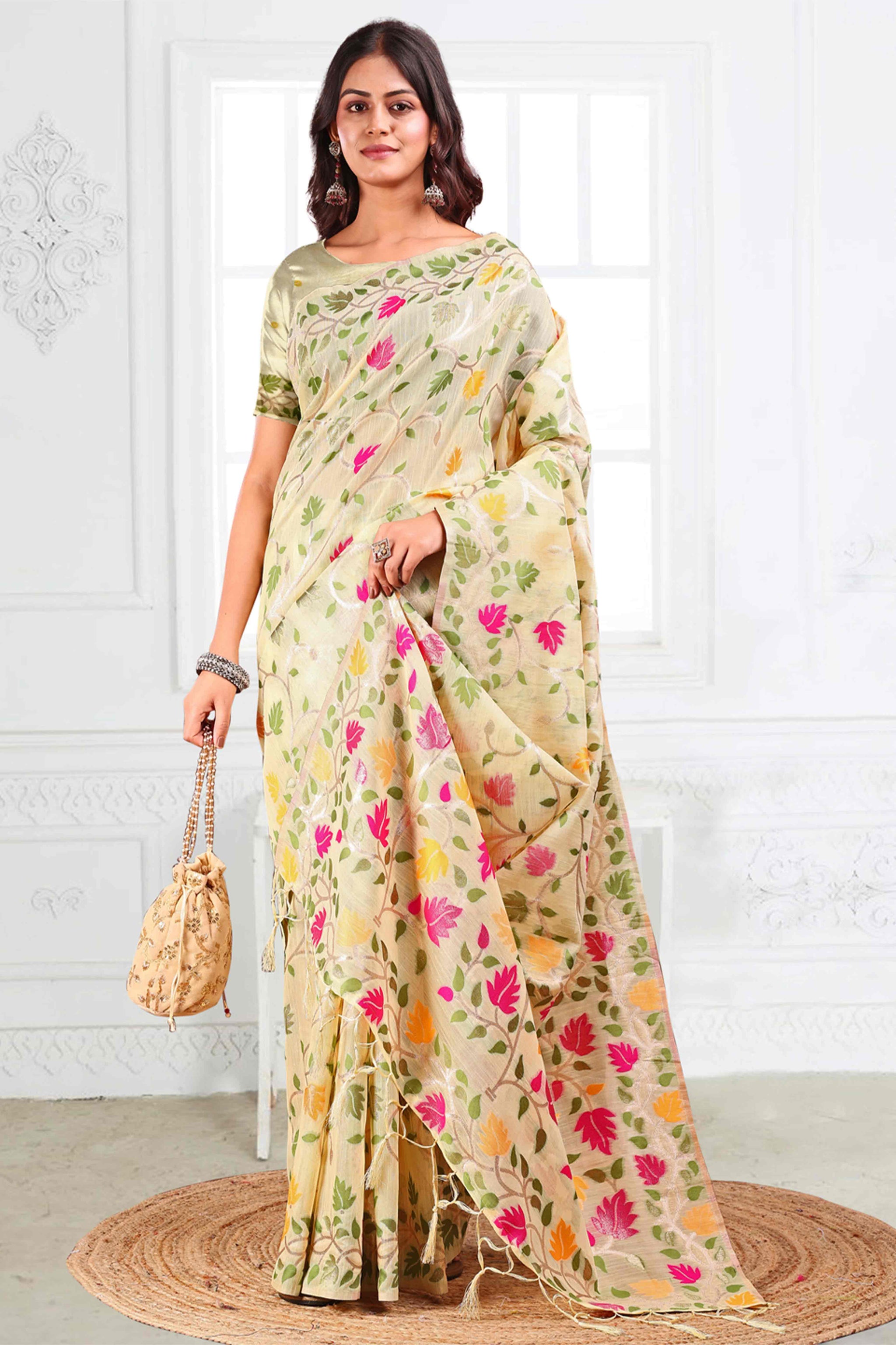 Cream Linen Cotton Silk  Saree Enhanced With Floral Zari Weaving & Tasselled Pallu Finish