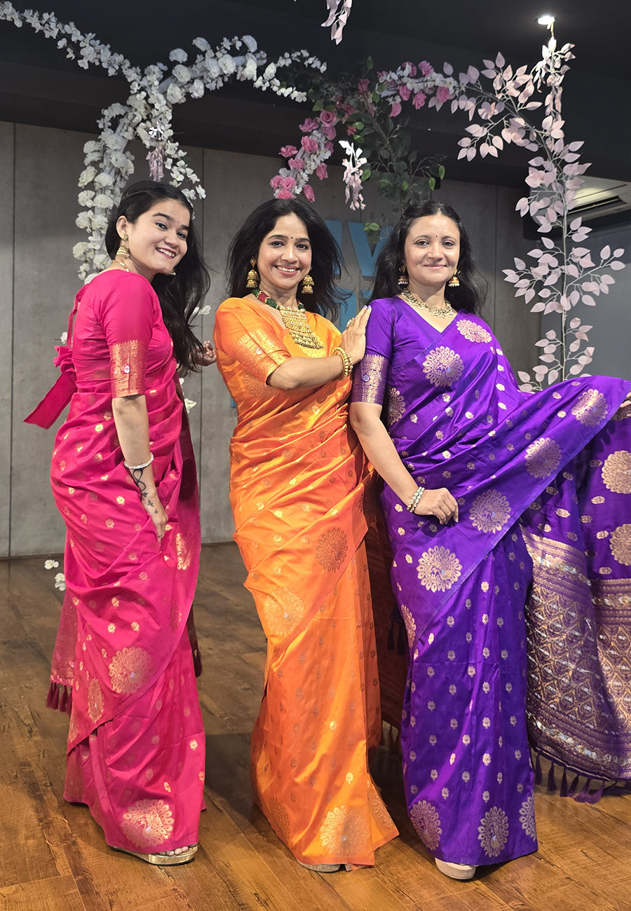 Orange soft silk dual zari woven saree with peacock border
