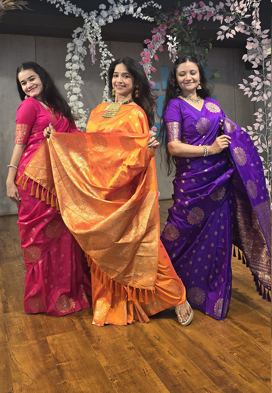 Orange soft silk dual zari woven saree with peacock border