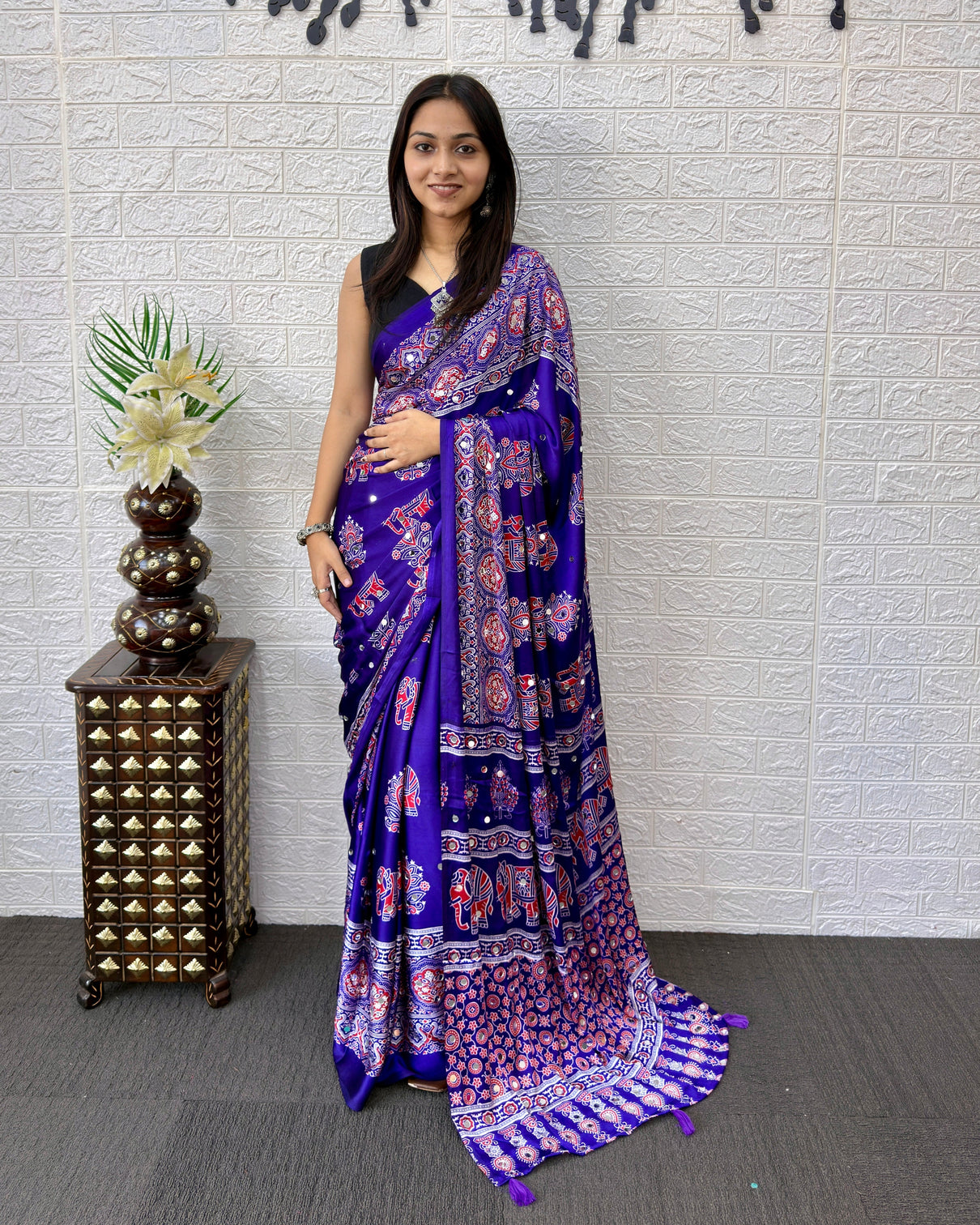 Royal purple modal silk ajrakh print saree with elephant motifs designer pallu tassels festive ethnic wear saree