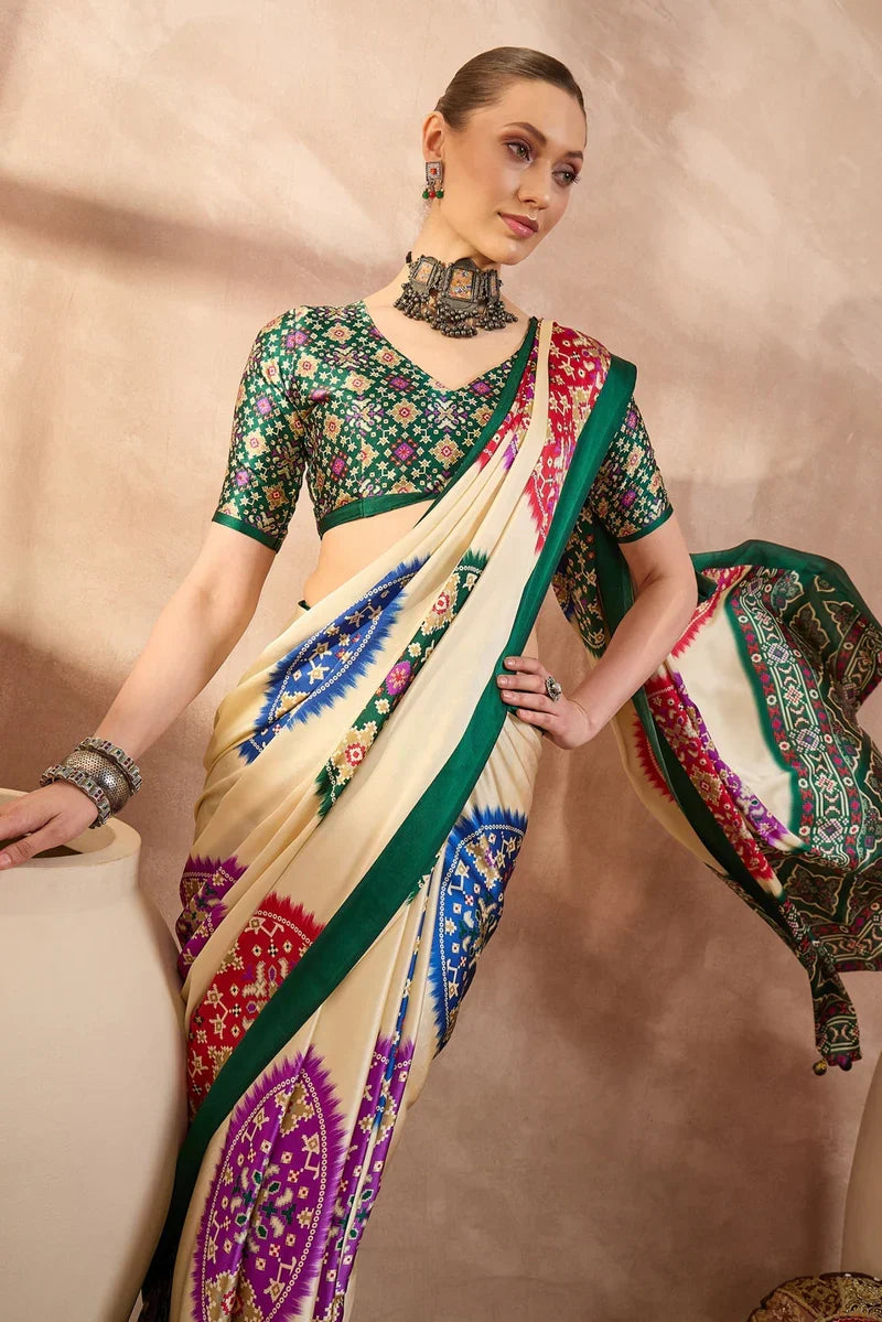 Cream modal silk saree with multicolor patola inspired print emerald green border traditional festive wear saree