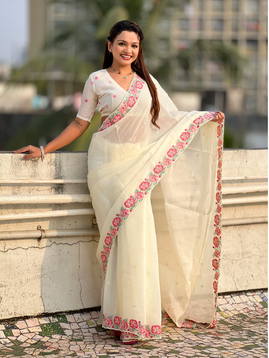 White pure crush embroidered saree with multicolor floral motifs and cutwork border