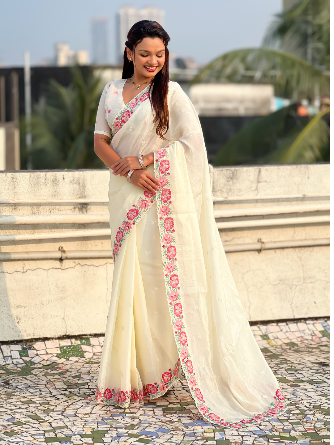 White pure crush embroidered saree with multicolor floral motifs and cutwork border