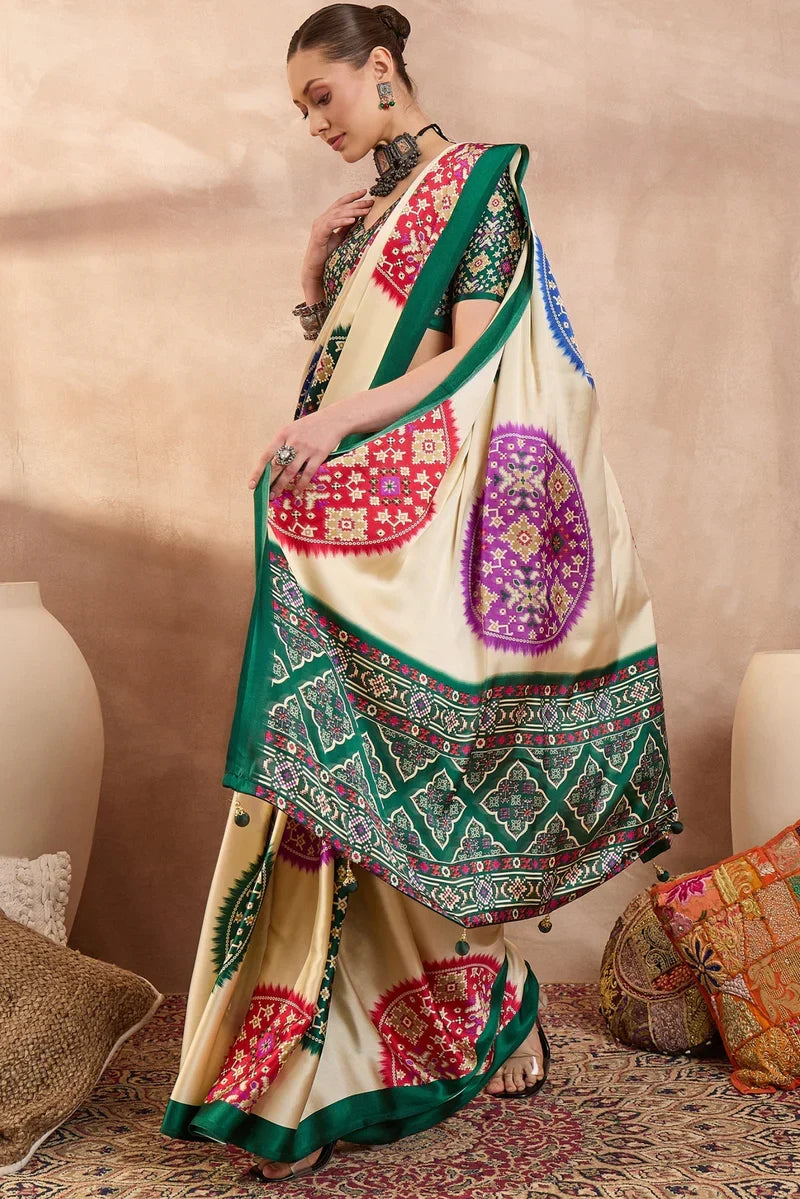 Cream modal silk saree with multicolor patola inspired print emerald green border traditional festive wear saree