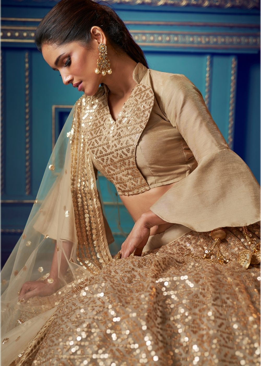 Golden Designer Soft Net Lehenga Choli with Ruffles and Sequin work