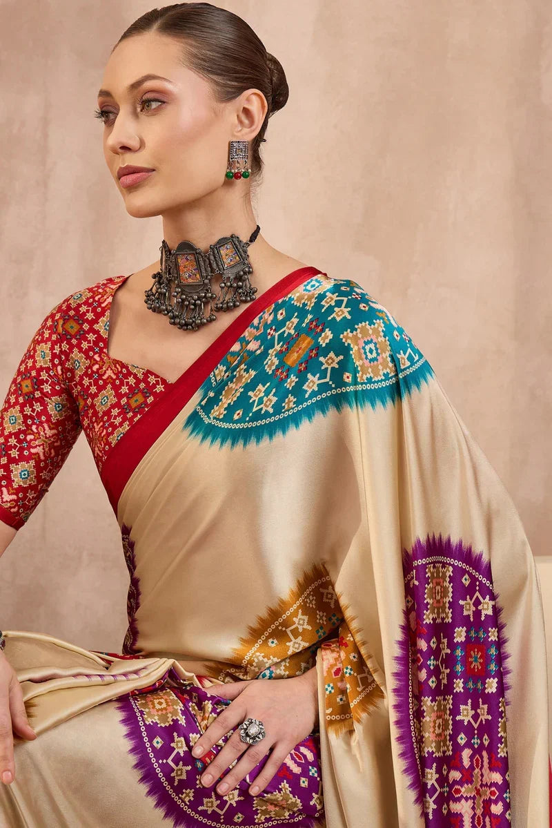 Cream modal silk saree with multicolor patola inspired print ruby red border designer festive wear saree