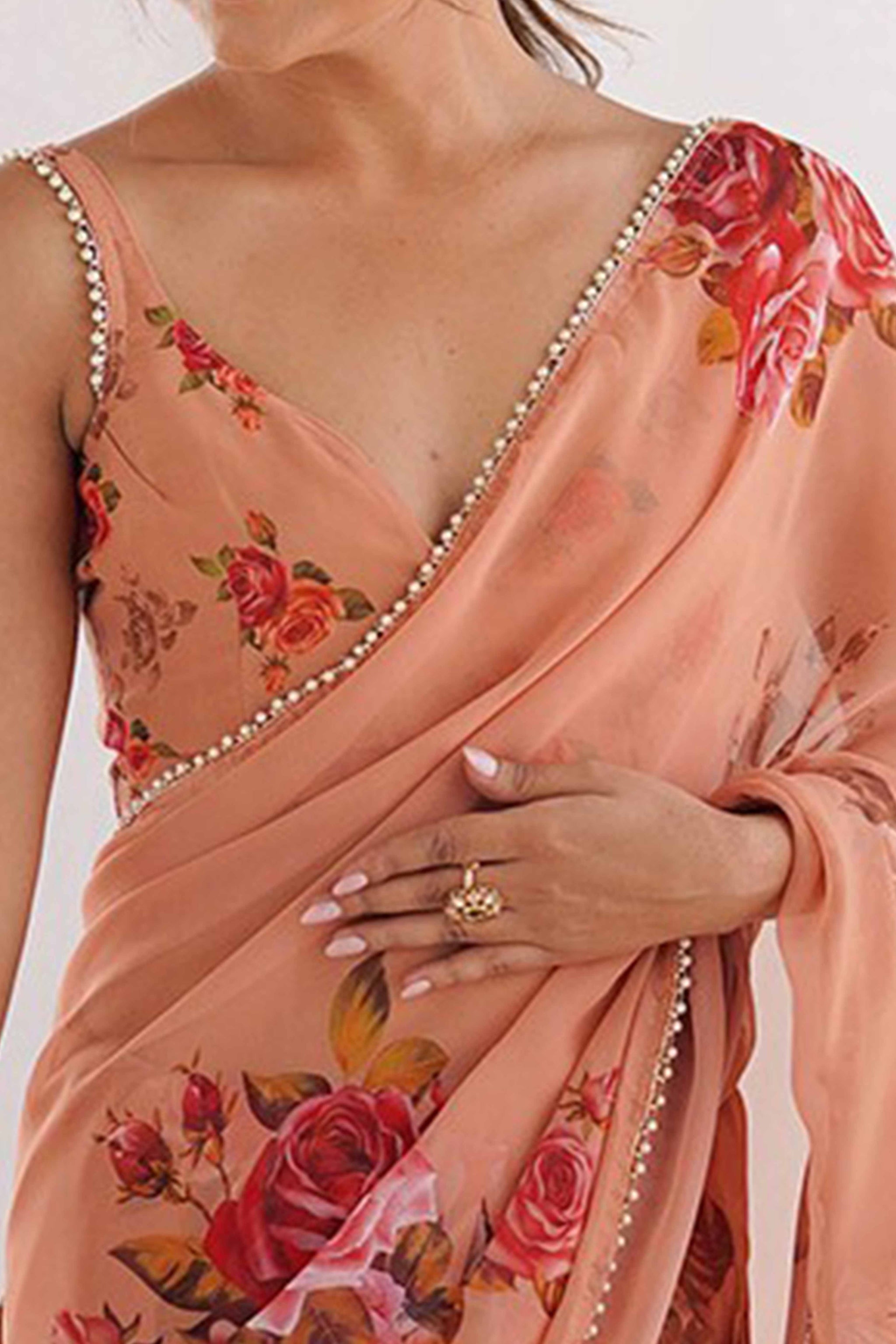 Partywear Peach Georgette Saree with Floral Prints and Bead Work Lace