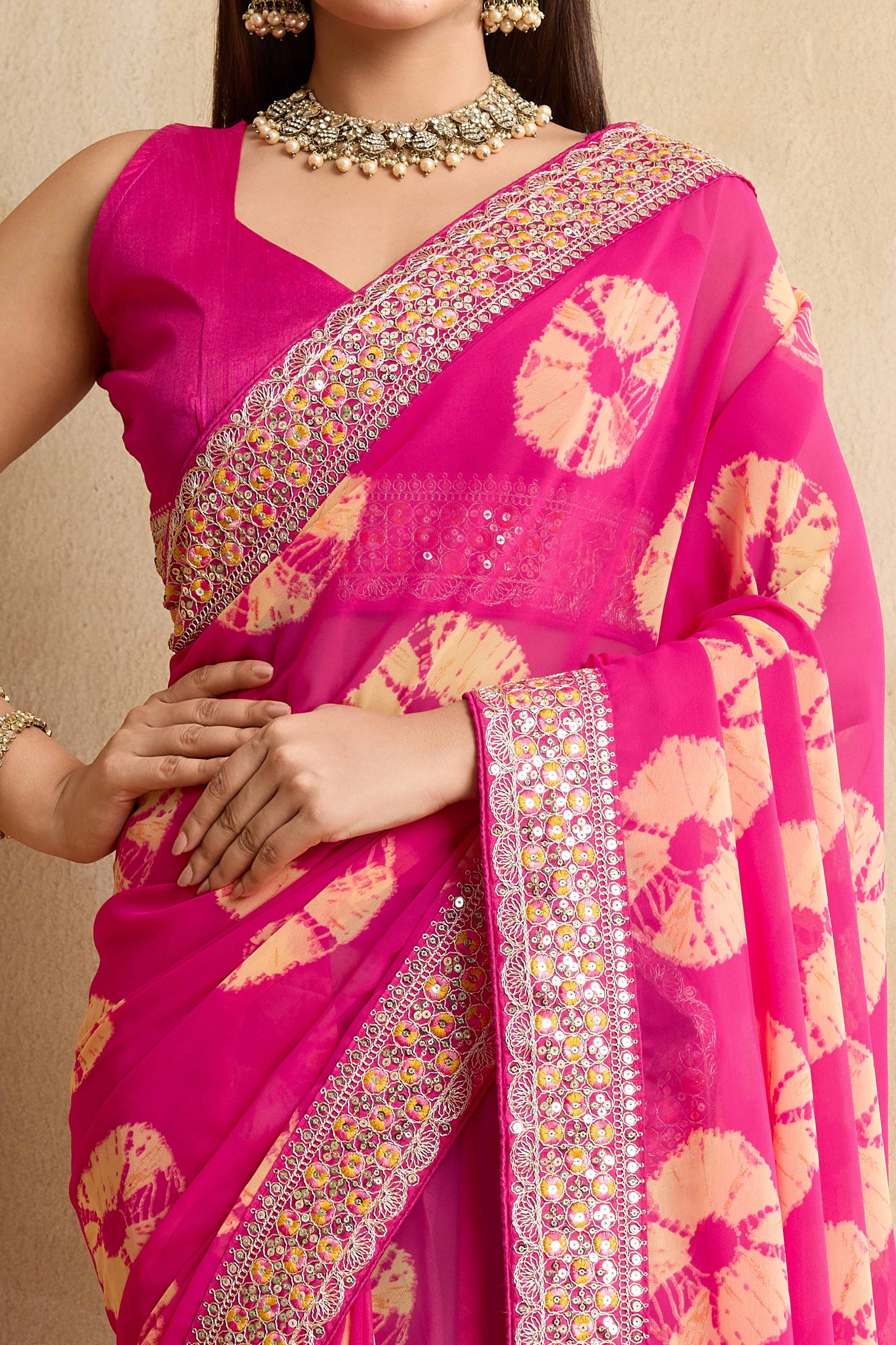 Pink Georgette Saree with Contemporary Tie-Dye Patterns and Classic Lace Work Finish