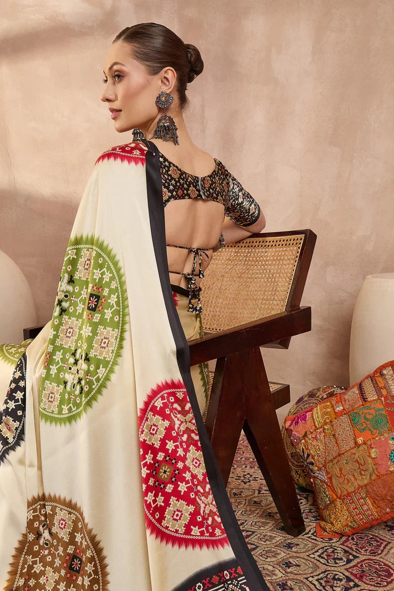 Ivory cream modal silk saree with patola inspired multicolor print black designer pallu festive traditional wear saree